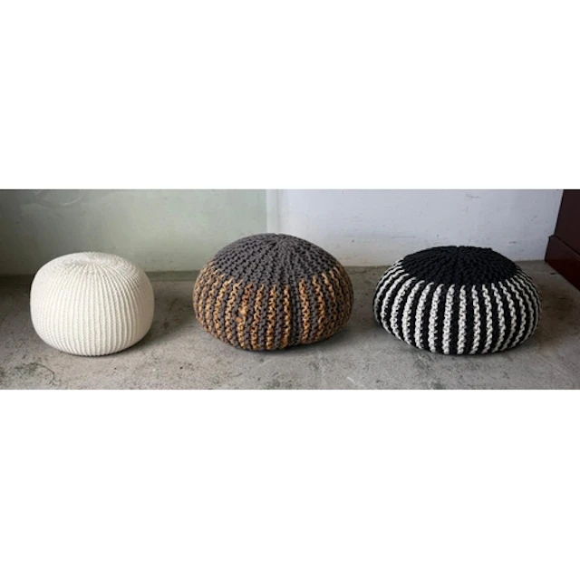 Three striped knitted pouffes or footstools.