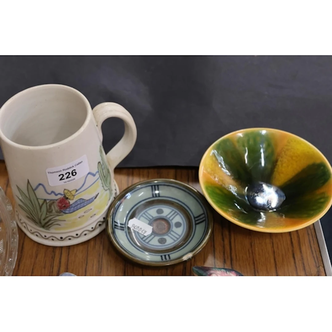 Highland Stoneware coaster, a Poole Pottery dish, and a Buch...