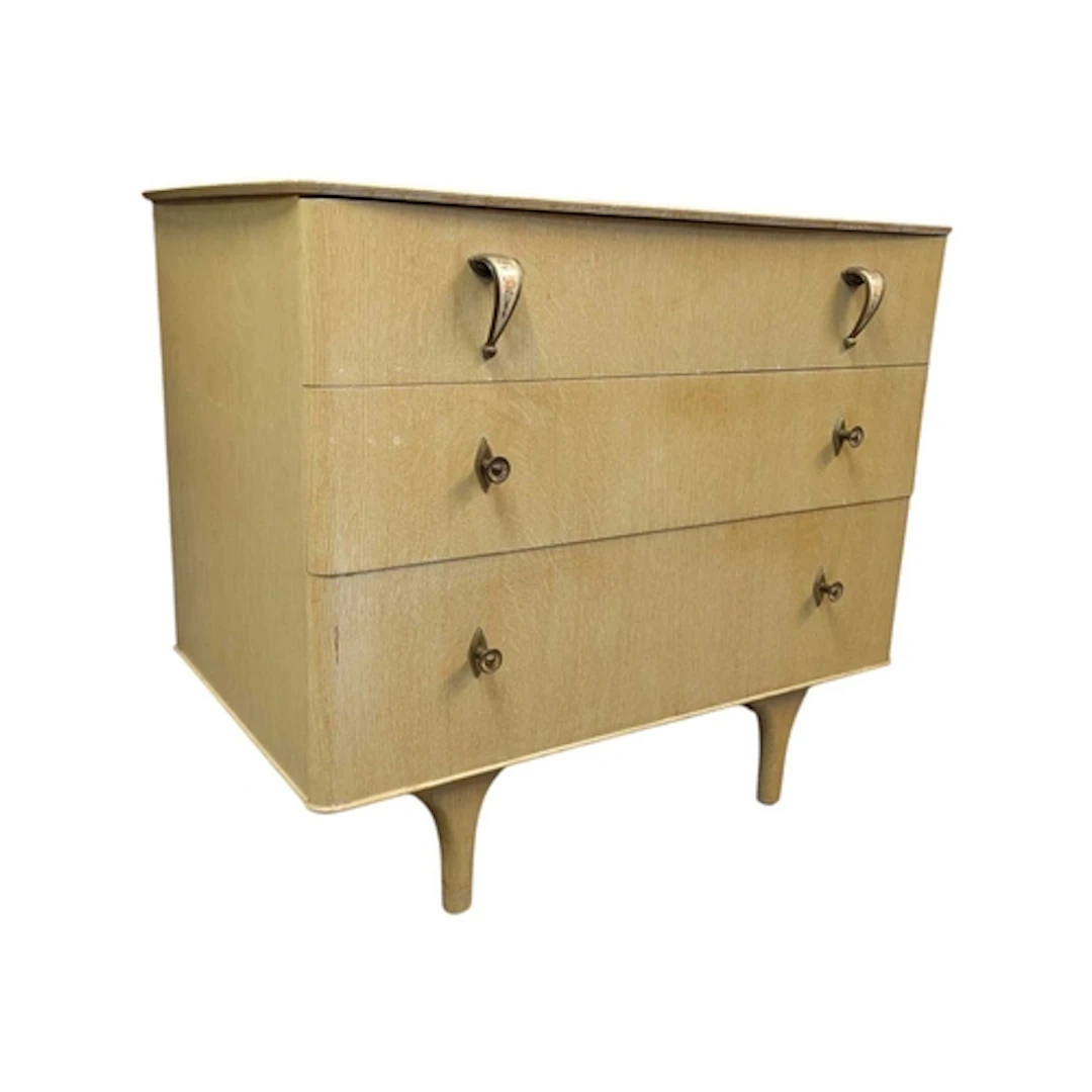 A mid 20th century circa 1950s chest of drawers. The chest o...