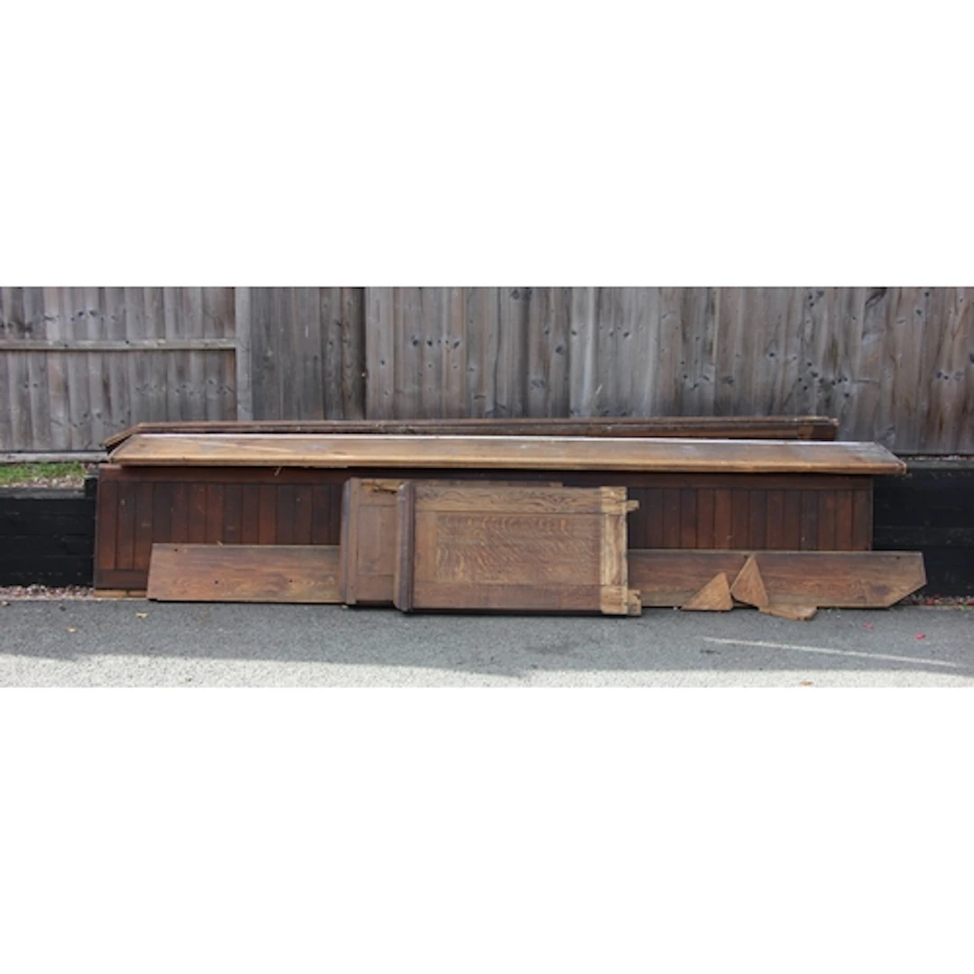 A large Victorian oak church pew, with panelled back, solid ...