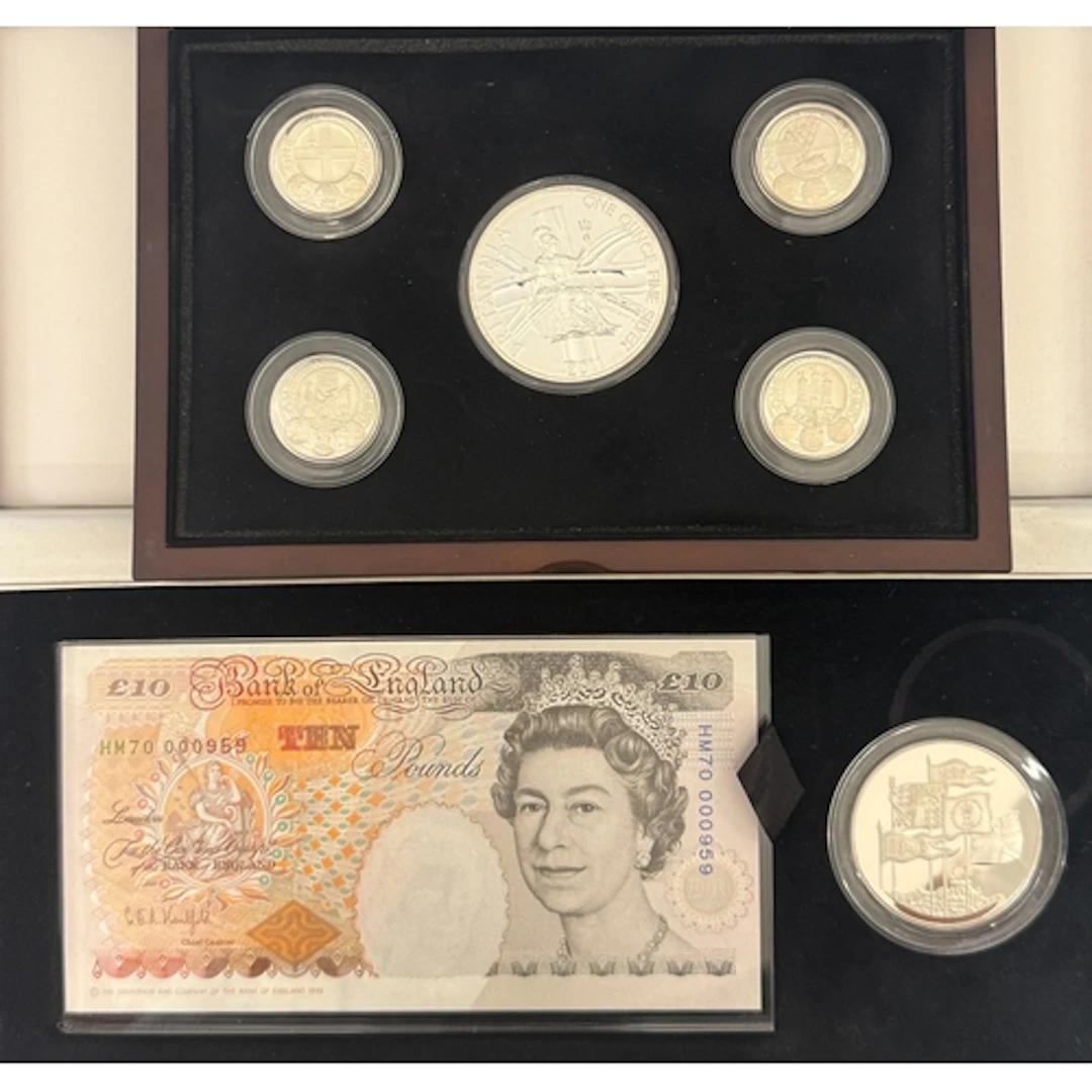 A group of two boxed UK sets, comprising a five-coin silver ...