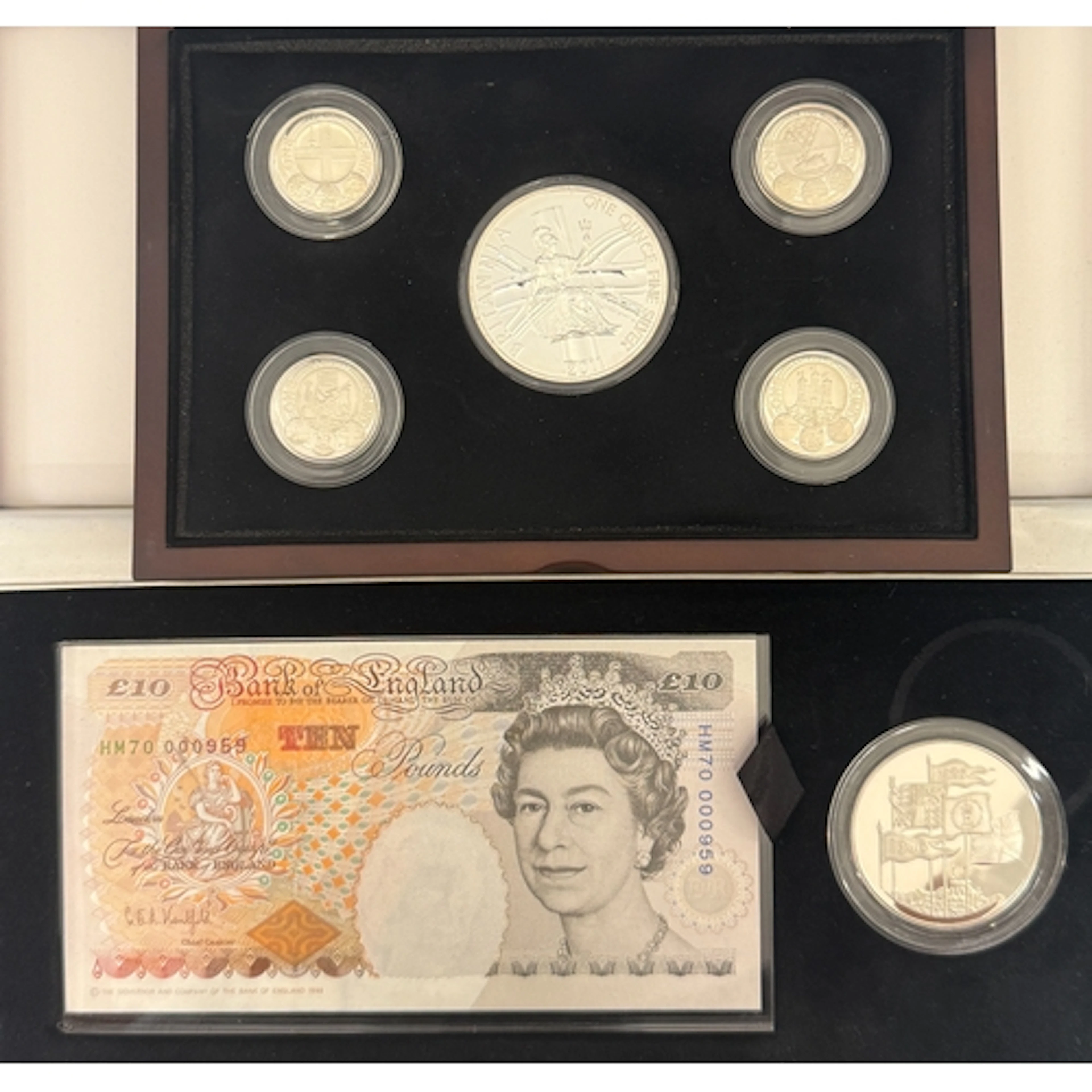 A group of two boxed UK sets, comprising a five-coin silver ...