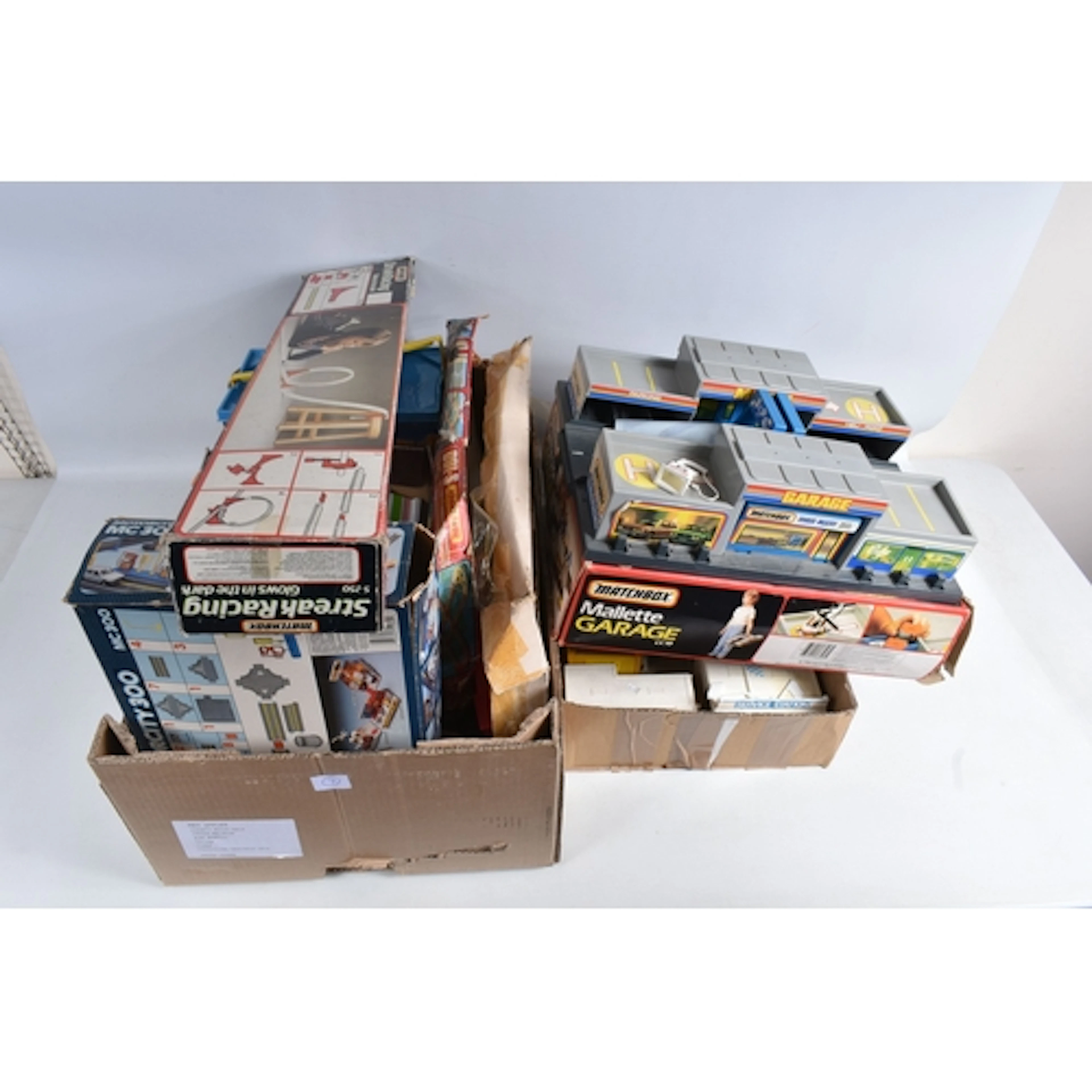 A QUANTITY OF BOXED MATCHBOX SETS AND COLLECTABLE GARAGES, t...