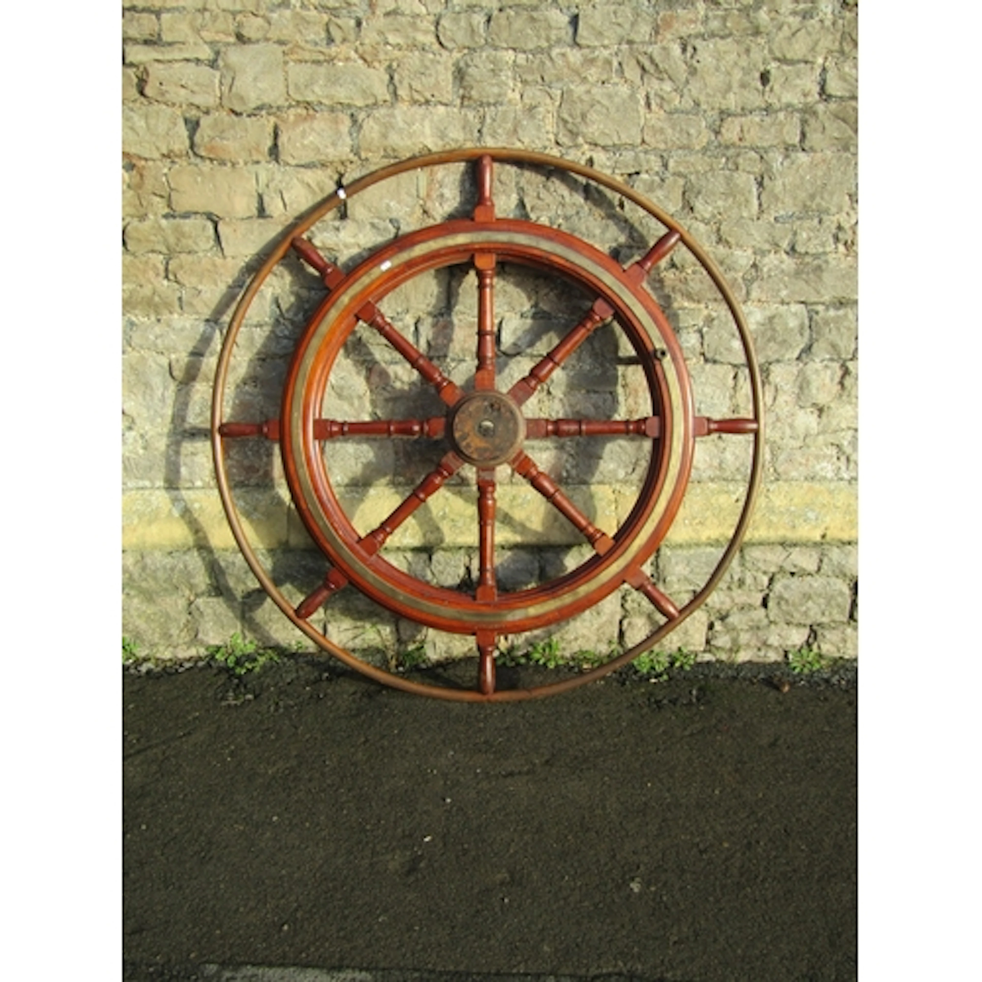 A large vintage teak Dutch barge steering/helms wheel with i...