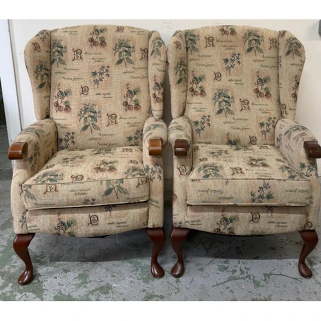 A pair of wing back chair with floral motif
