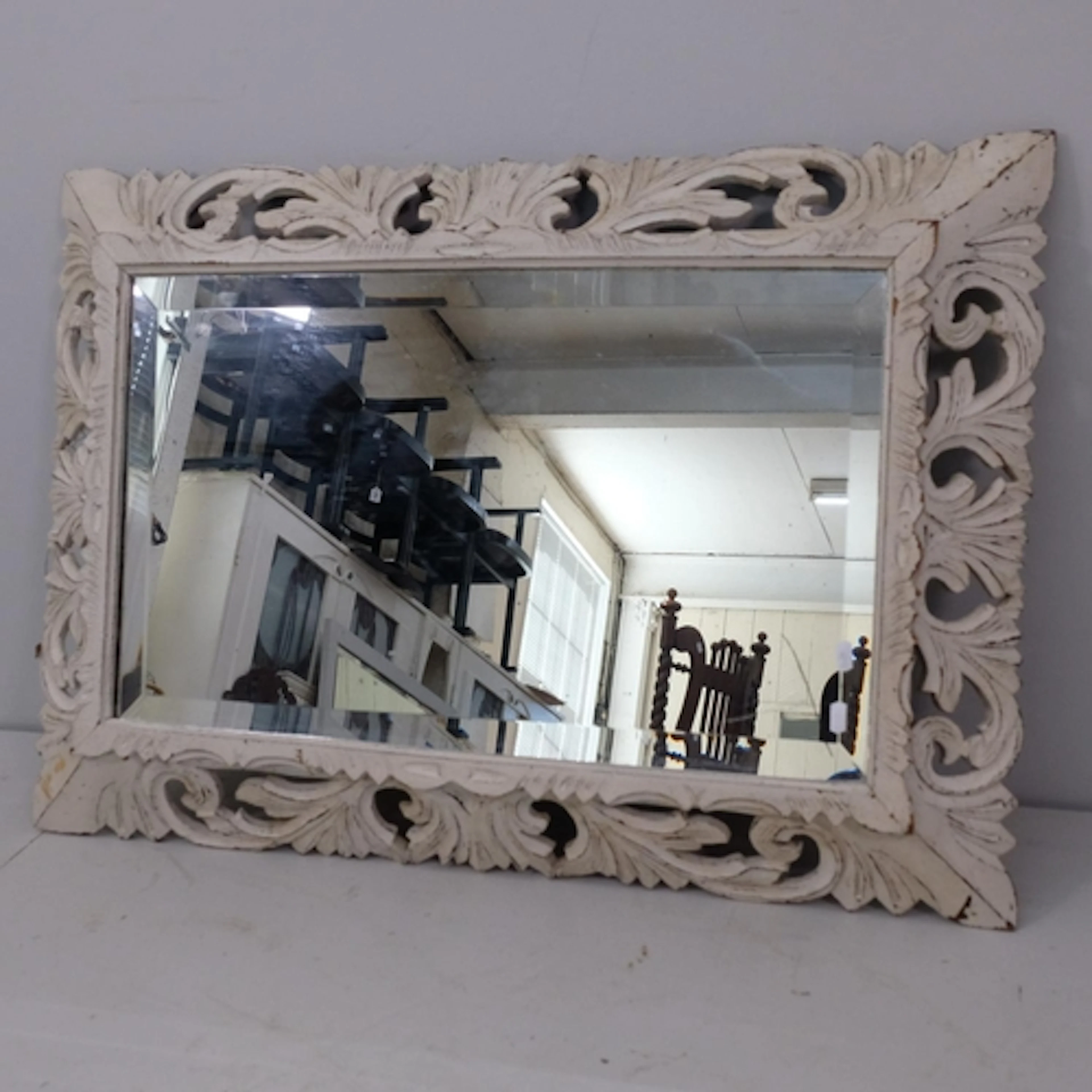 A French painted wall mirror, with open carved surround, W10...
