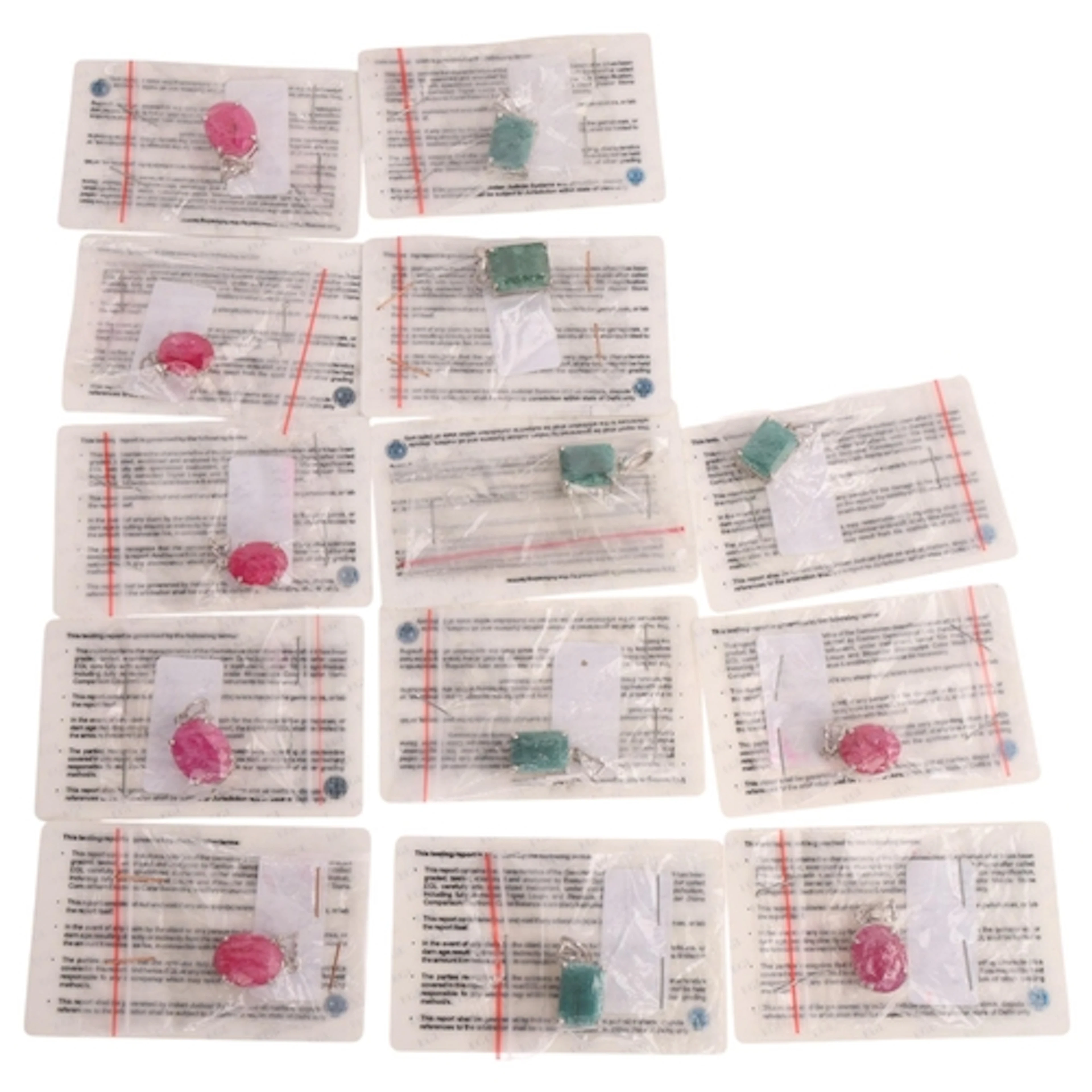 13 silver gemstone pendants, comprising emerald and ruby, al...