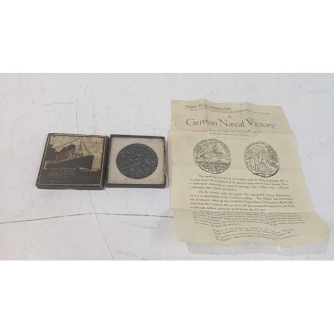 A cased R.M.S Lusitania medal with paperwork Location: If th...