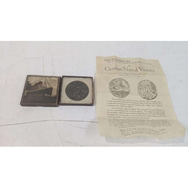 A cased R.M.S Lusitania medal with paperwork Location: If th...