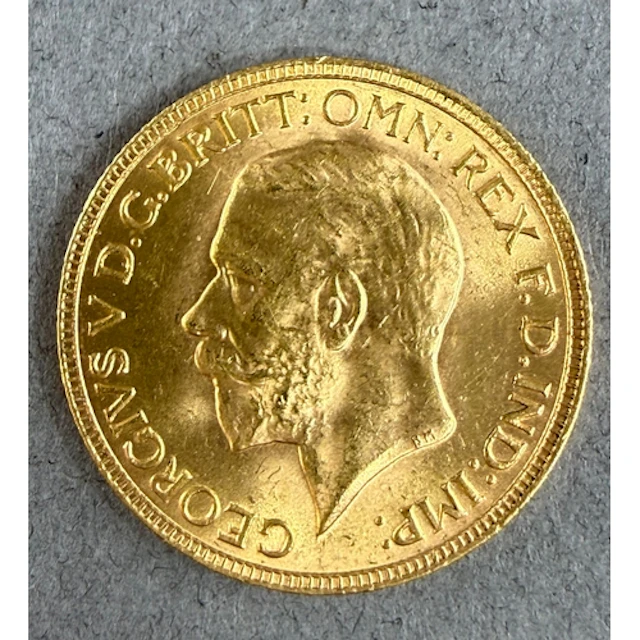 Coins: a 1931 George V full gold sovereign, circulated....