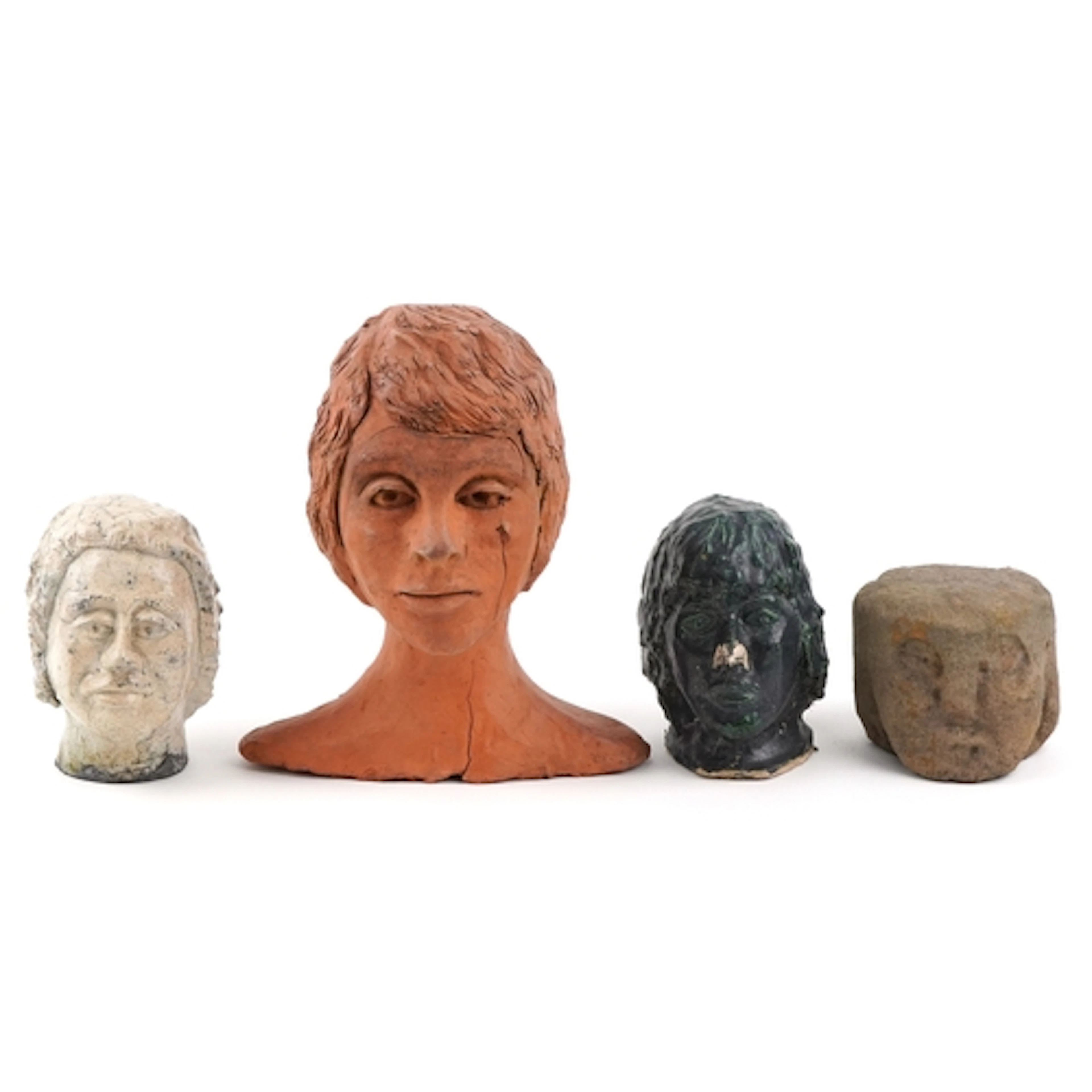 Four antique and later pottery sculptures of human heads com...
