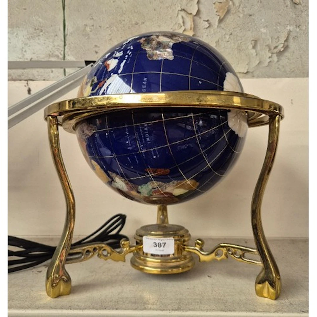 A terrestrial globe composed of semi precious stones