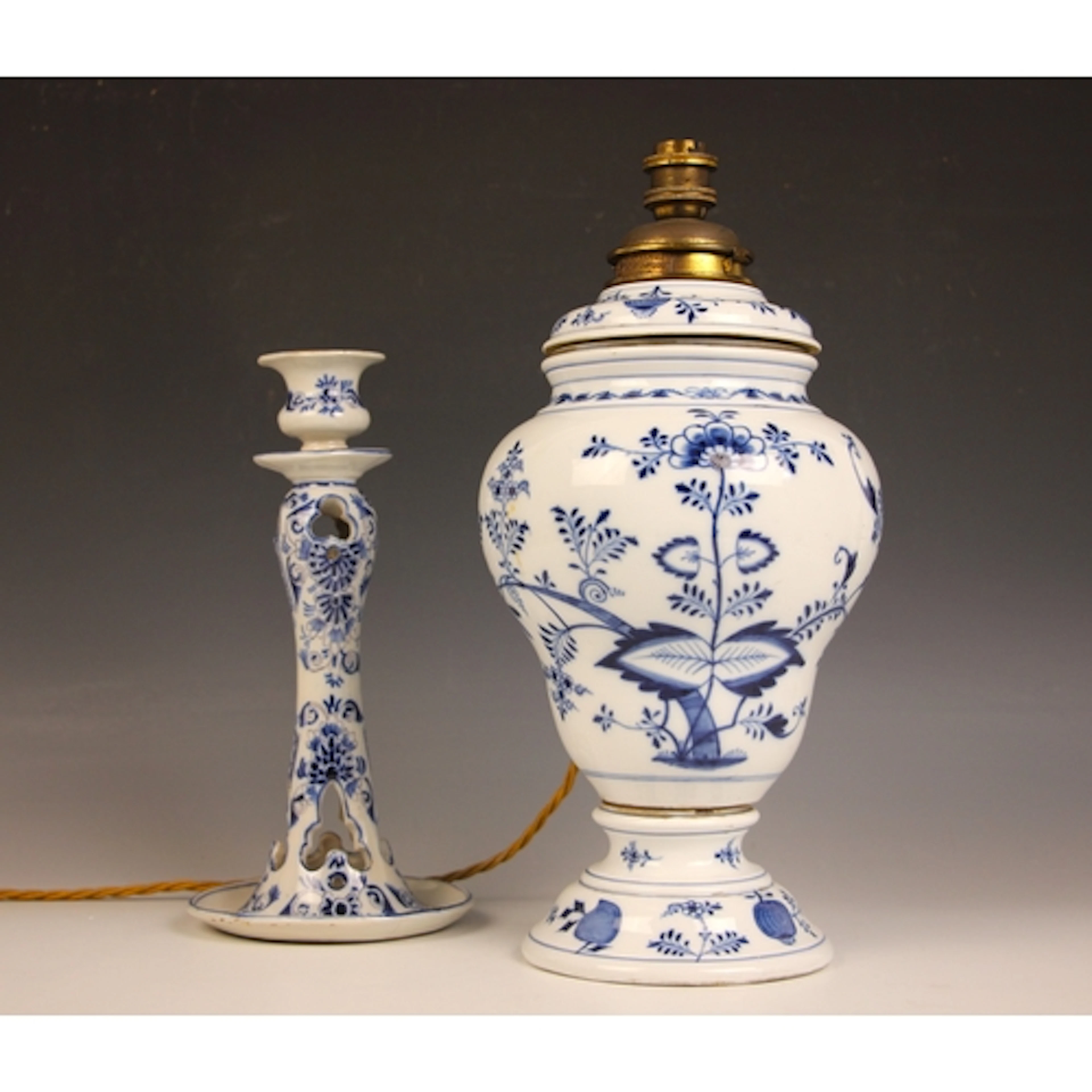 A Meissen blue and white porcelain oil lamp in the onion pat...