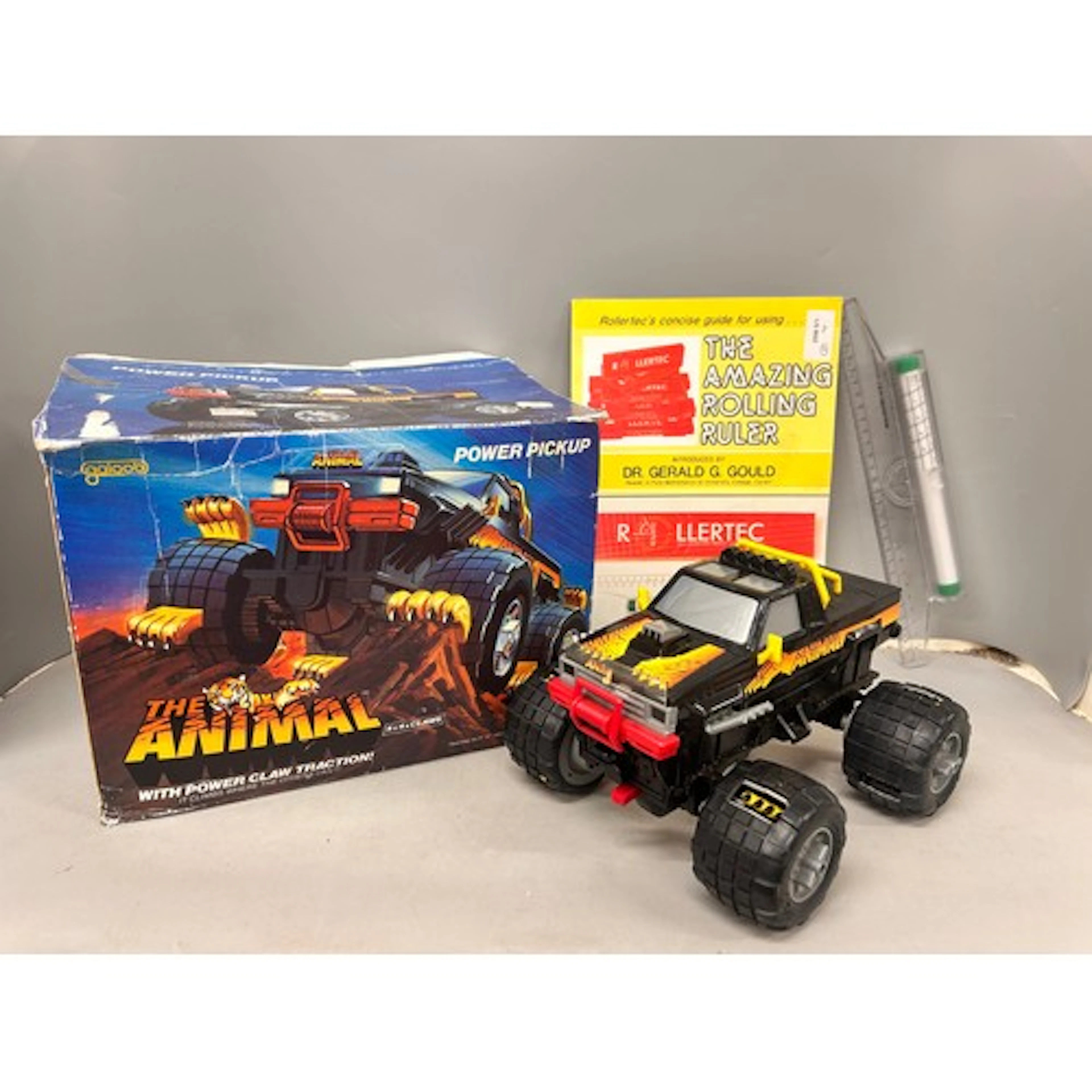 A Galoob The Animal Power Truck toy vehicle together with a ...