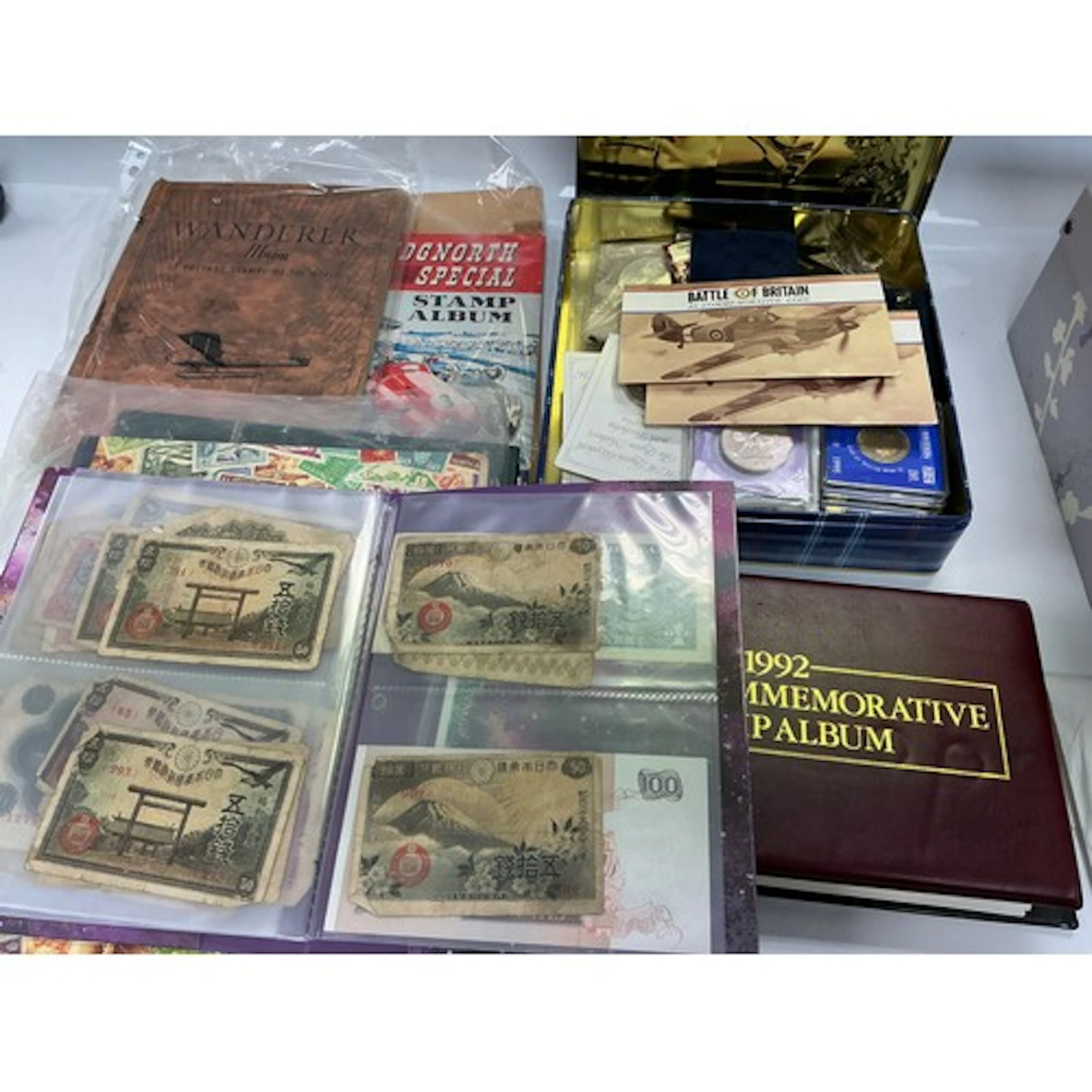 A box of stamps, first day covers, coins etc.