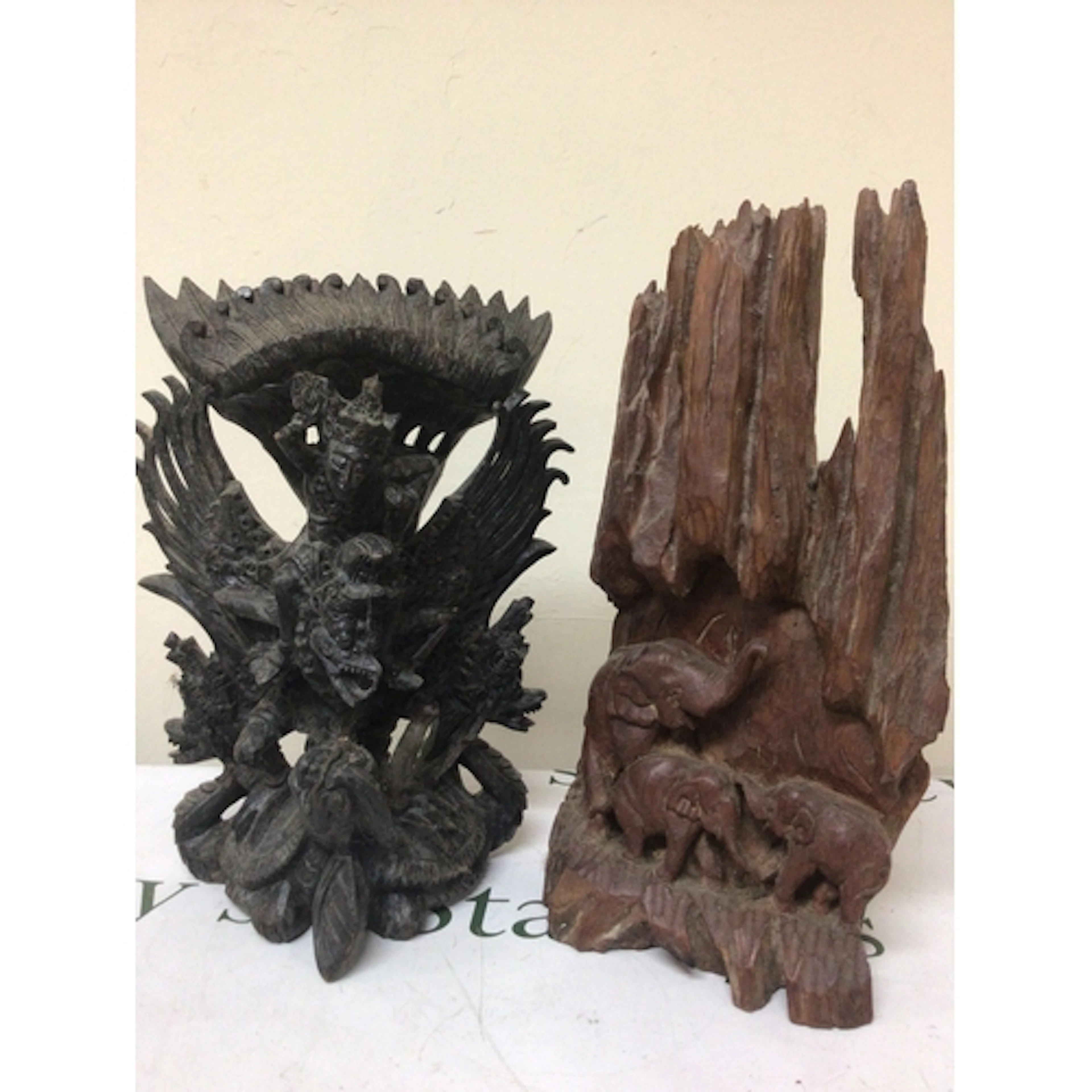 A carved hardwood Balinese Hindu figure group of the Deiety ...