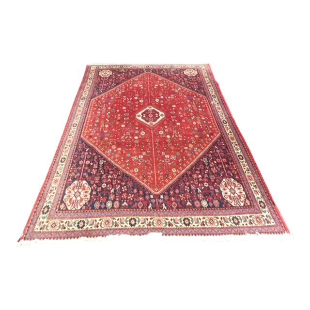 A red ground Bidjar rug with white geometric central medalli...
