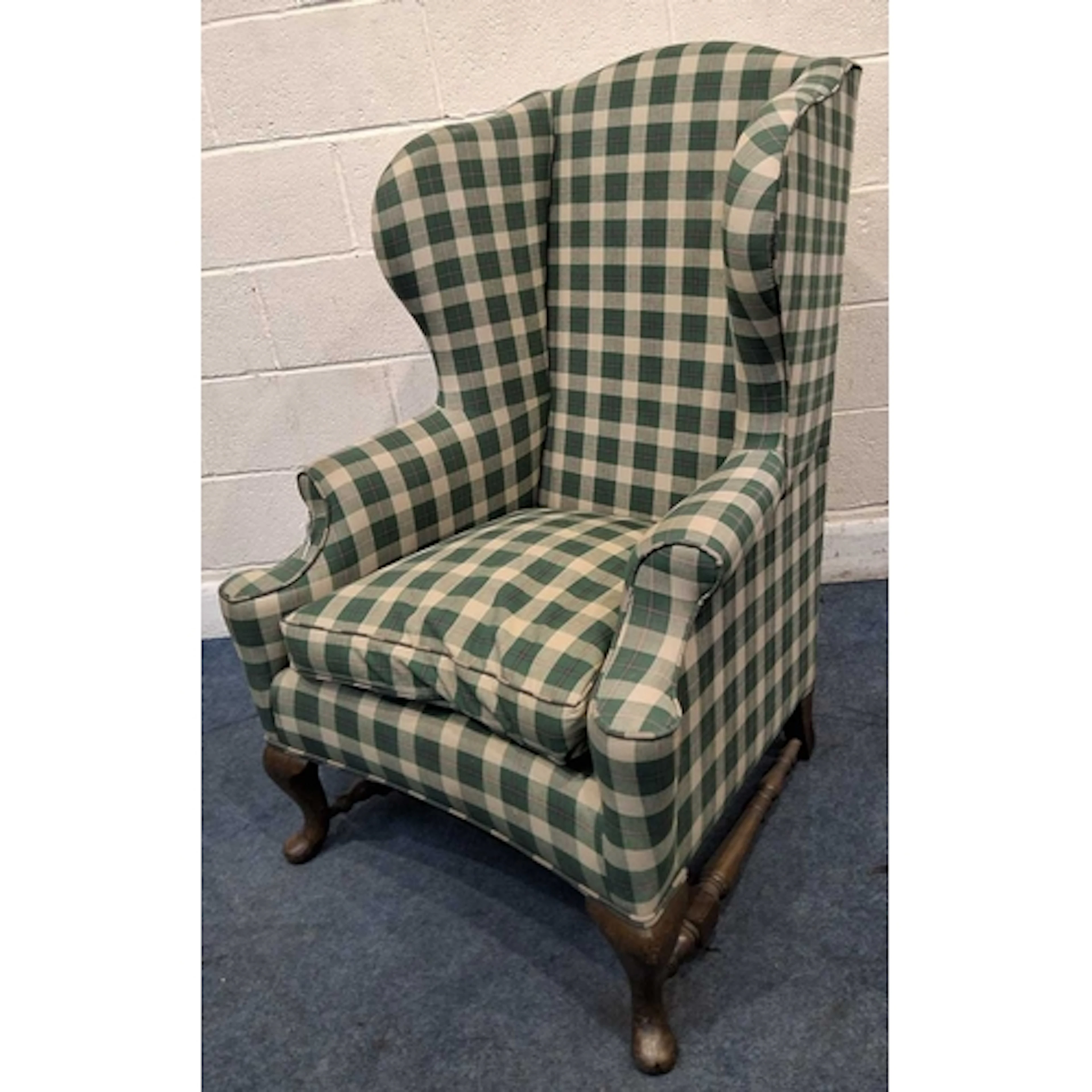 AN EARLY 20TH CENTURY WING BACK ARMCHAIR, with later tartan ...