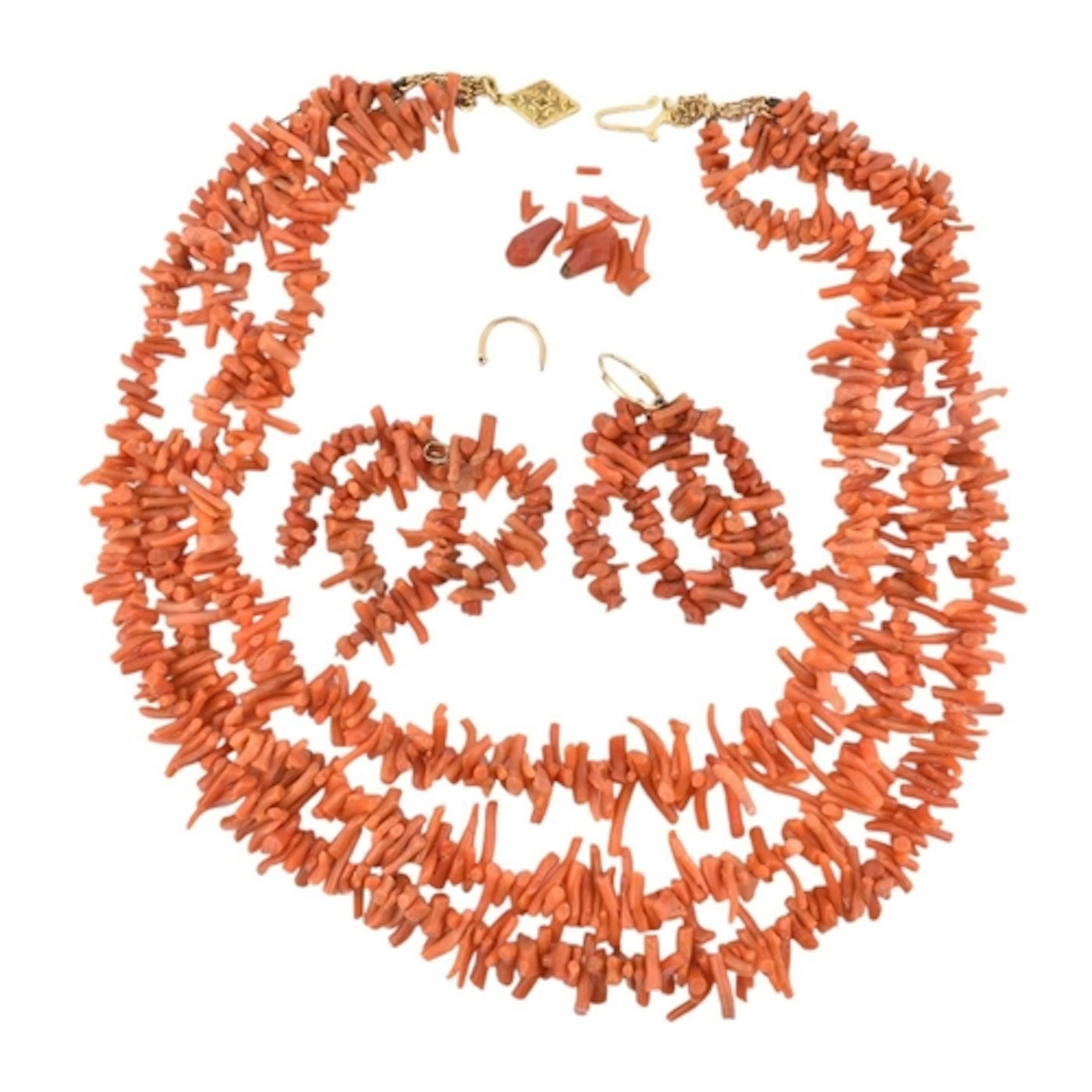 A yellow metal and spezzati coral multi-strand necklace toge...
