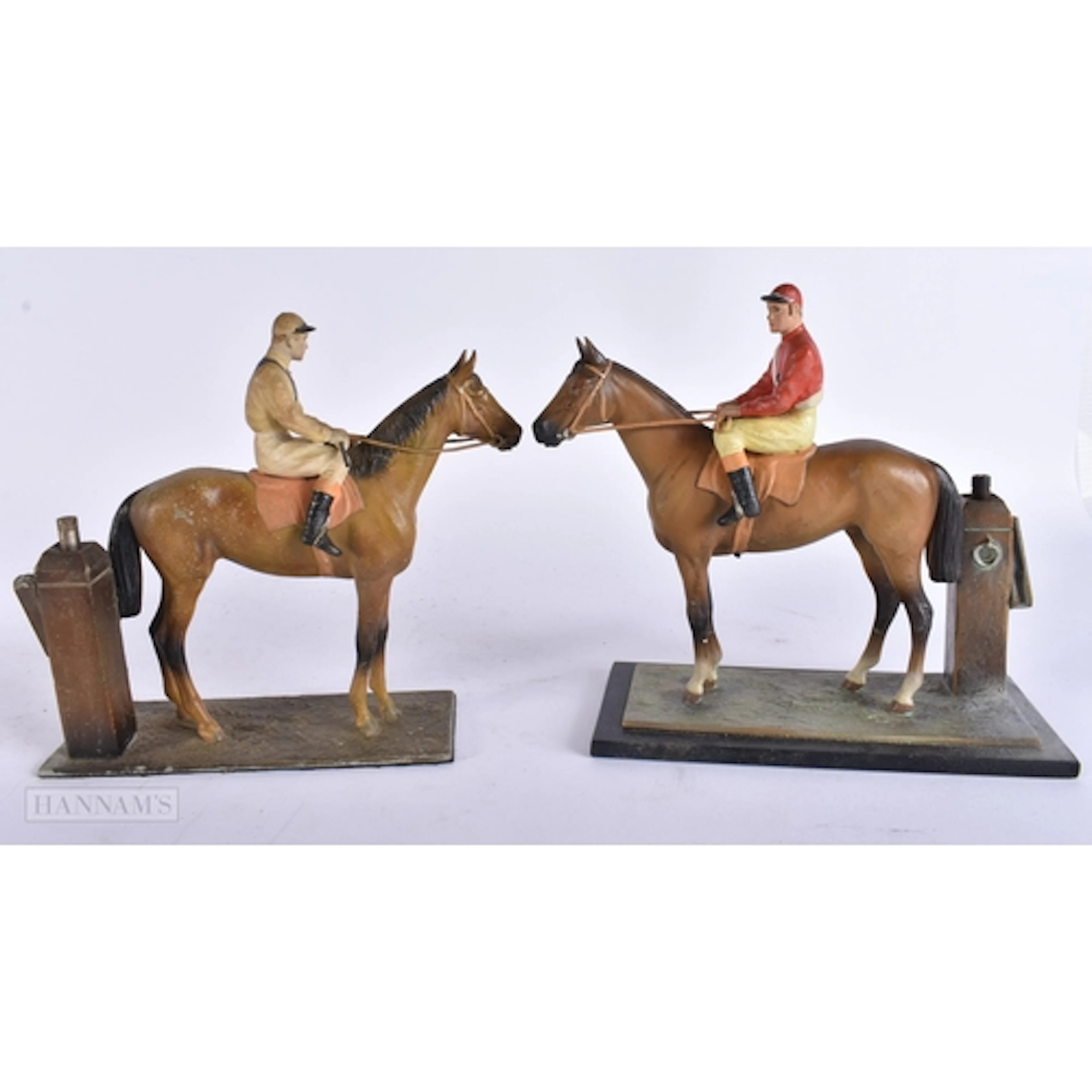 A PAIR OF ART DECO EQUESTRIAN COLD PAINTED SPELTER LIGHTERS....