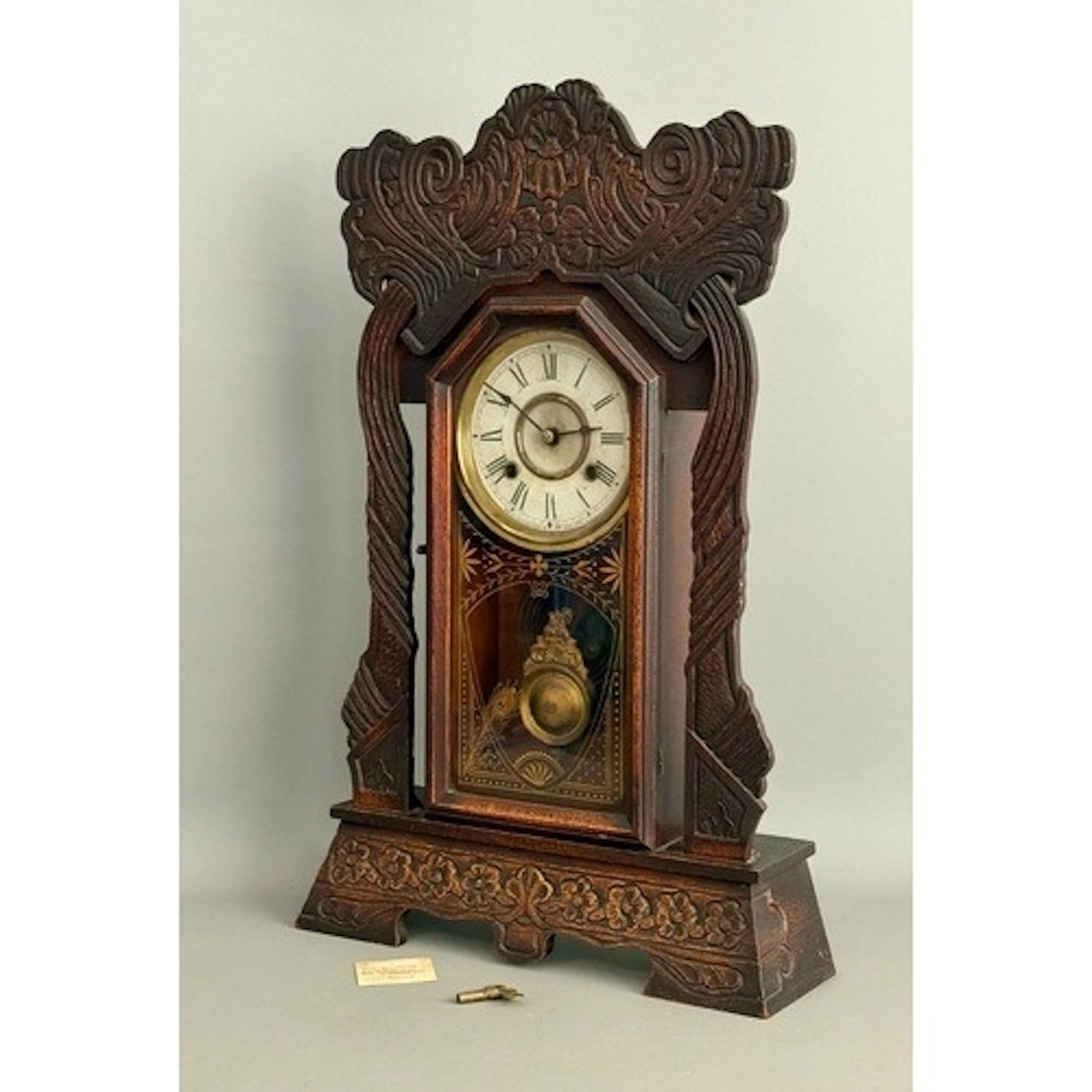 A late 19th century American oak drop dial mantel clock by N...