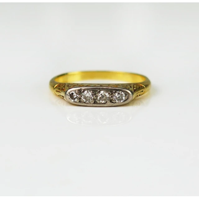 An old European cut diamond four stone ring in a high carat ...