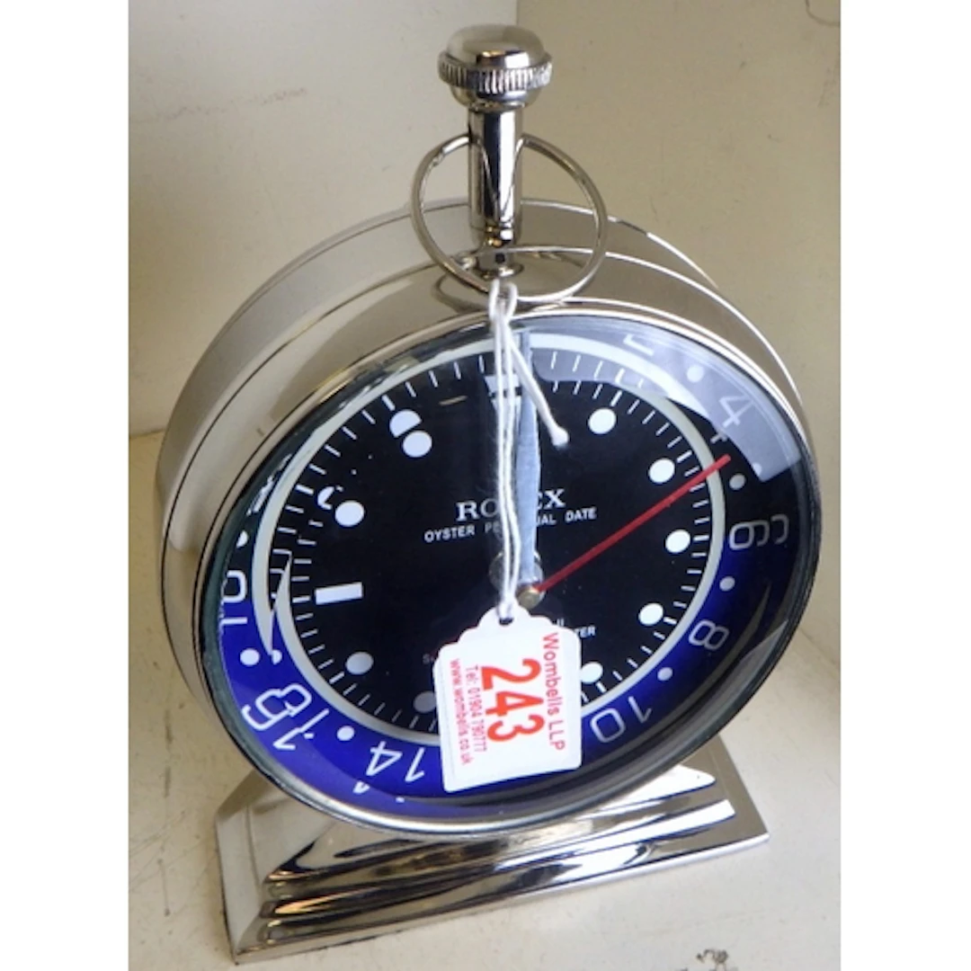 A modern chrome novelty clock