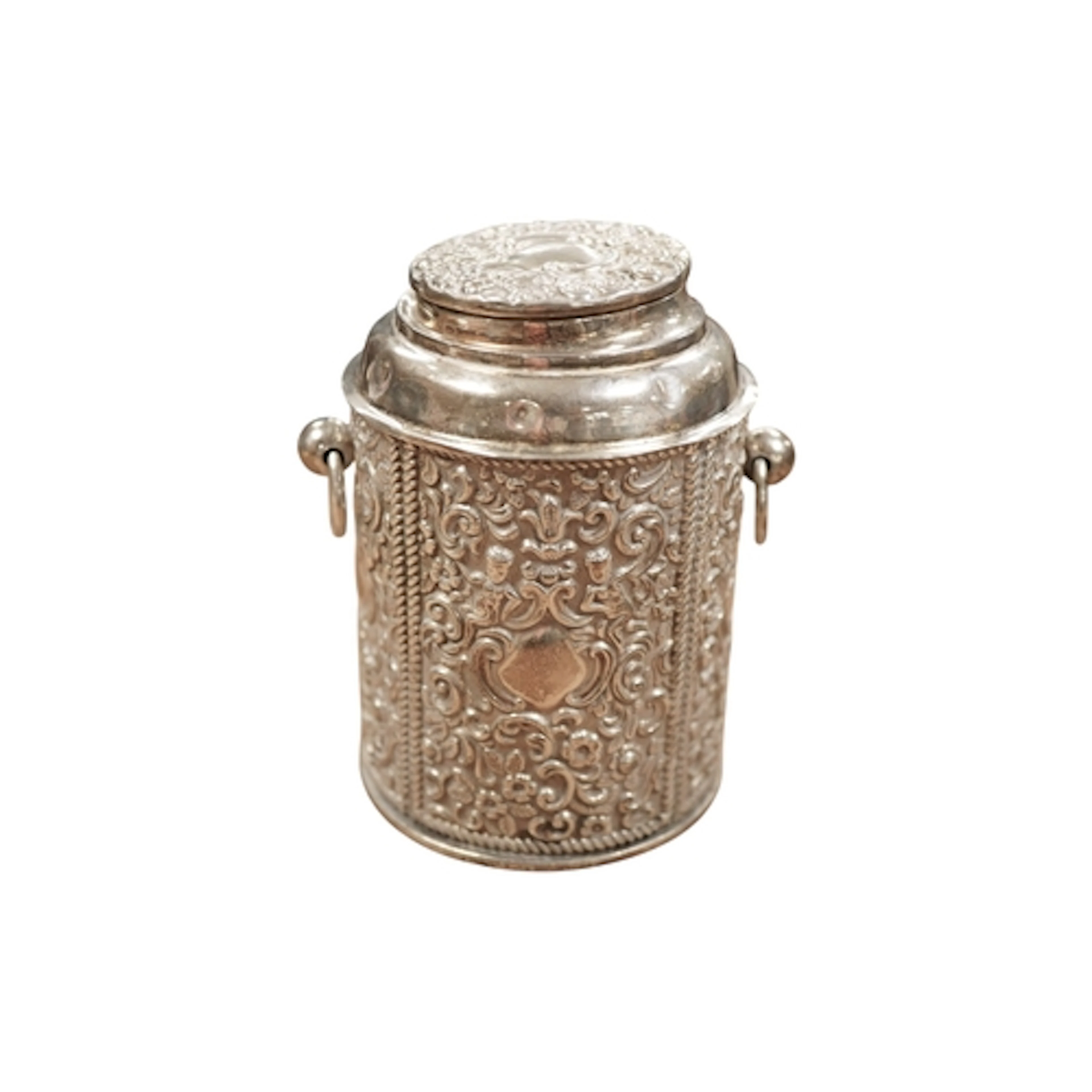A late Victorian embossed silver tea caddy and cover with tw...
