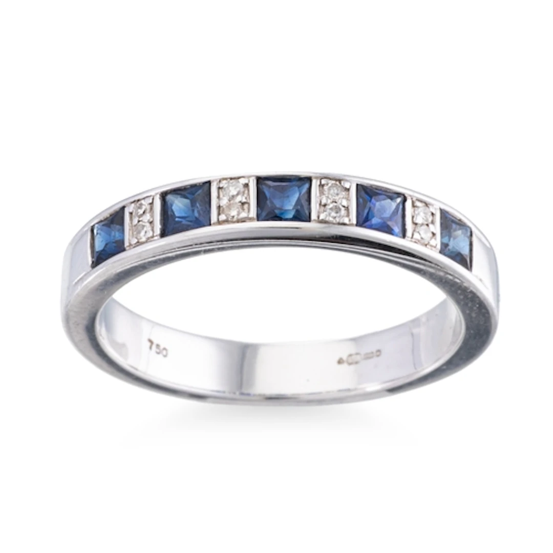A SAPPHIRE AND DIAMOND HALF ETERNITY RING, mounted in 18ct w...