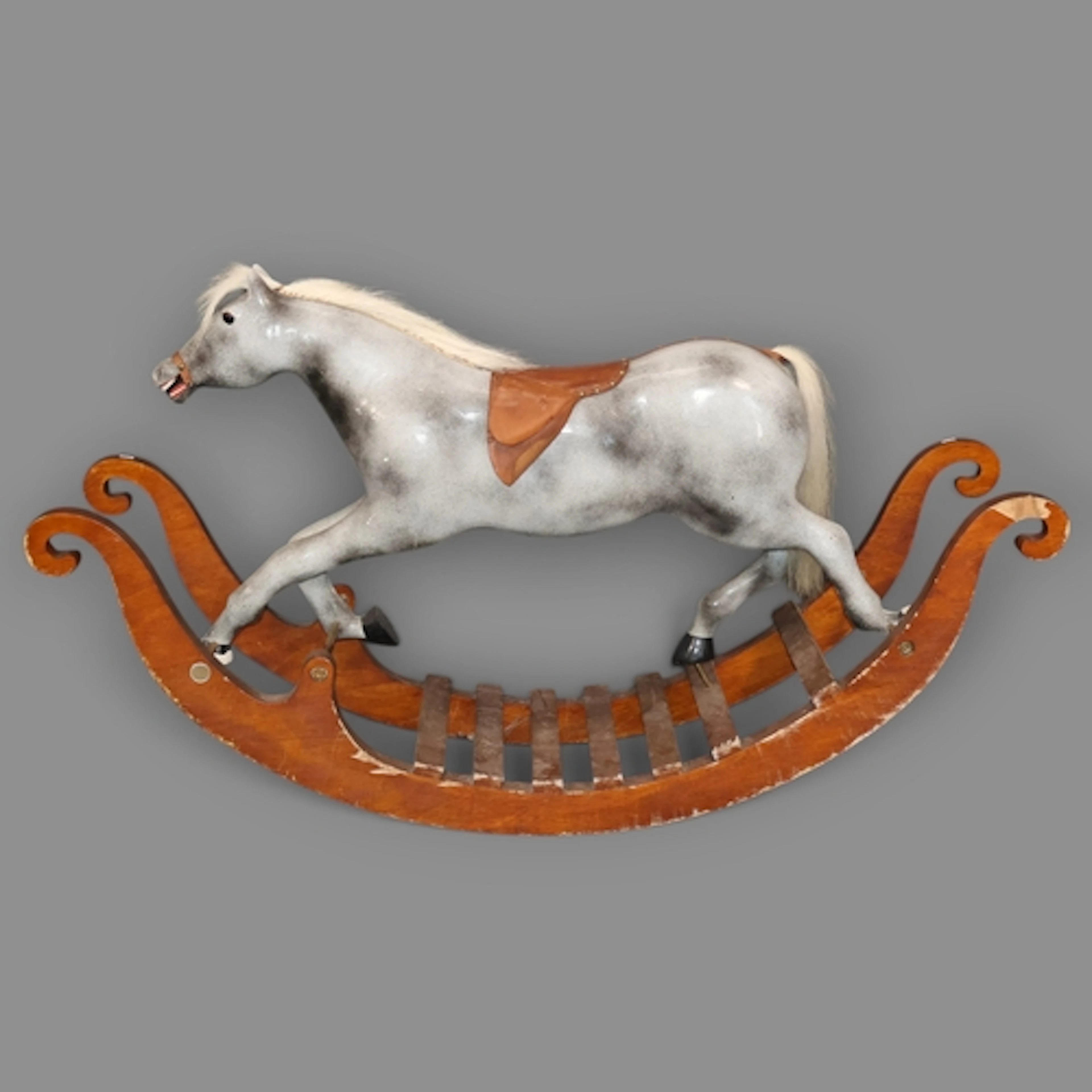 A Vintage hand painted rocking horse by Bob Page, raised on ...