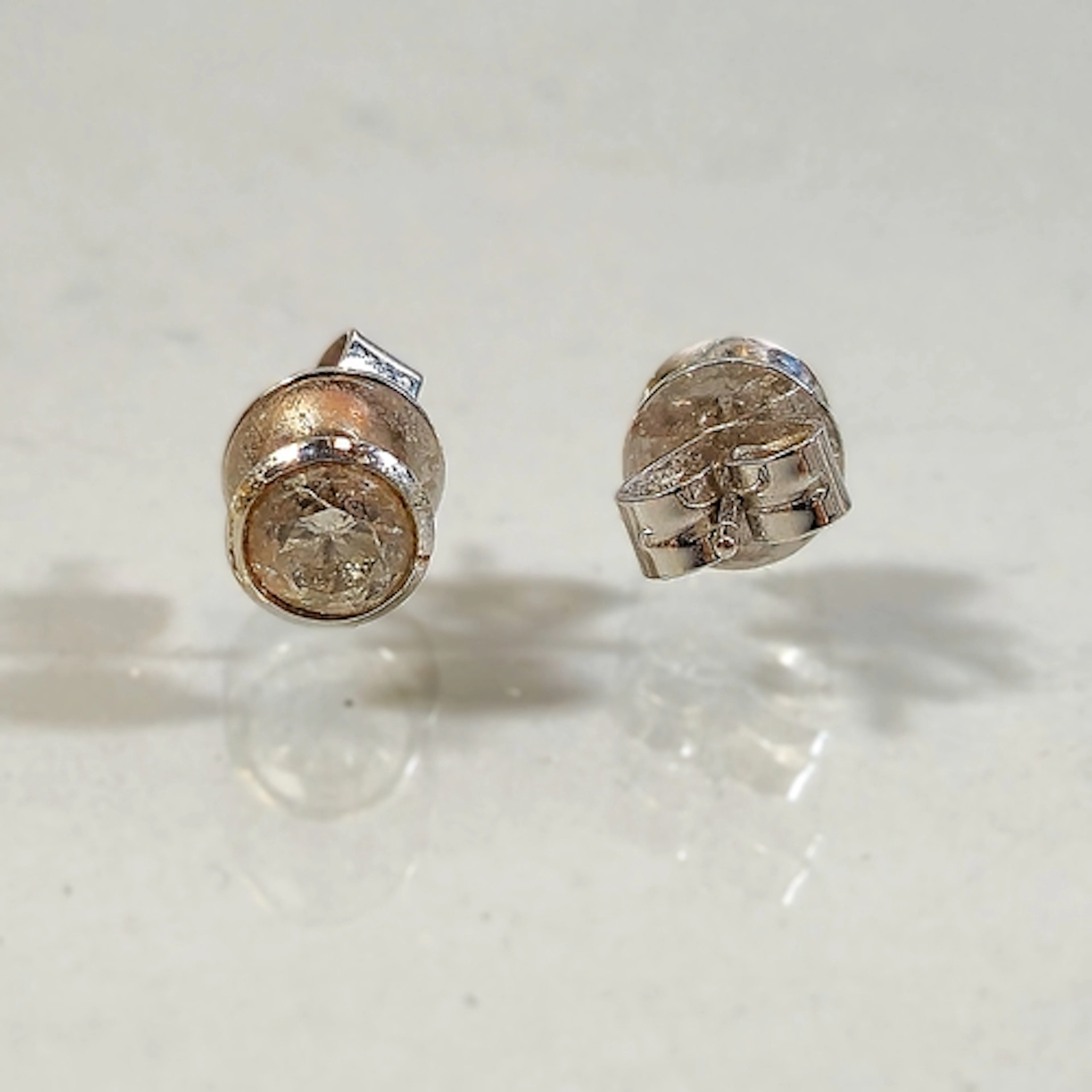 Pair of 18ct white gold and diamond earrings, set with an ol...