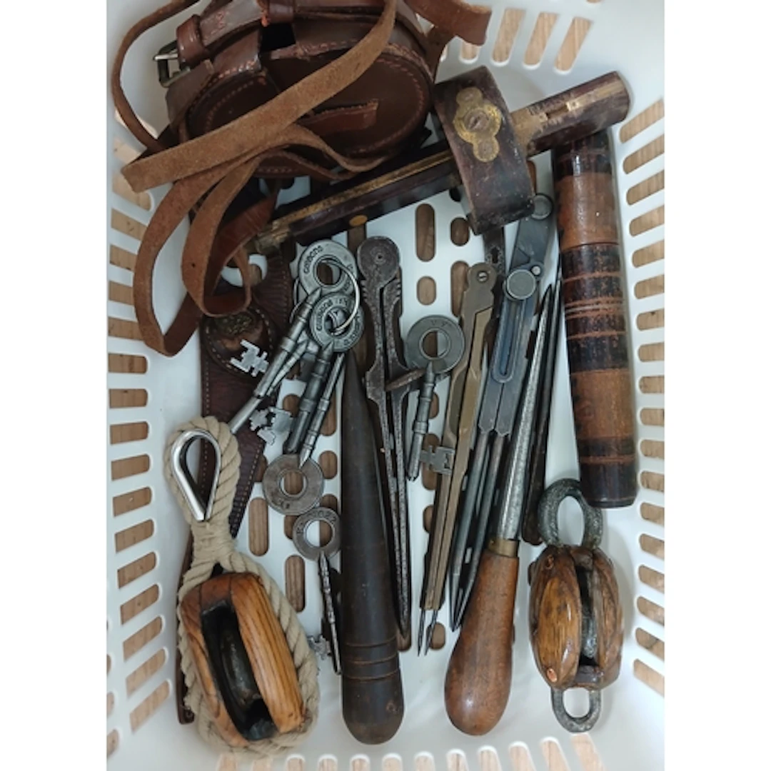 A box of assorted collectables including keys, fids, compass...