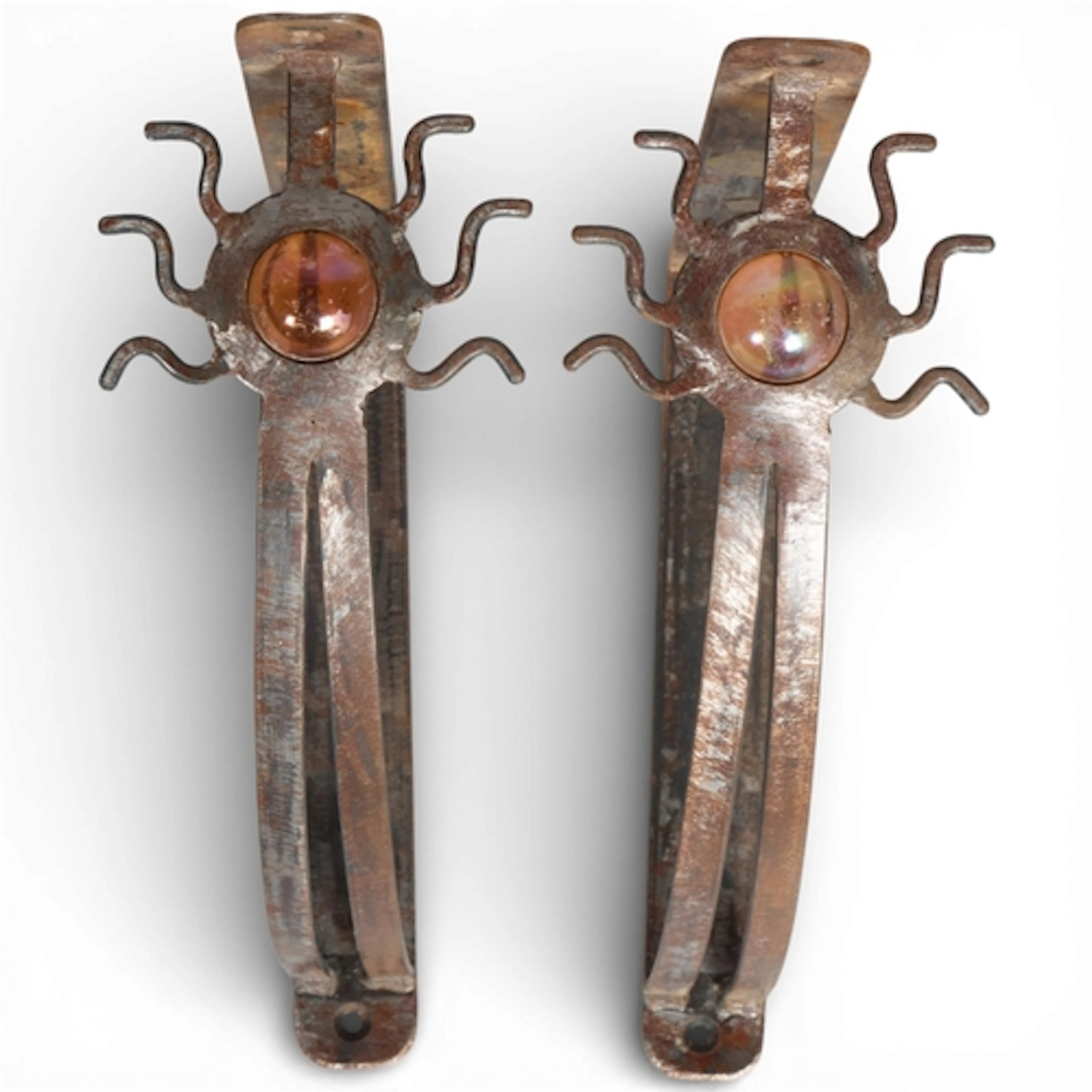 A pair of 1980s brutalist welded steel shelf brackets with g...