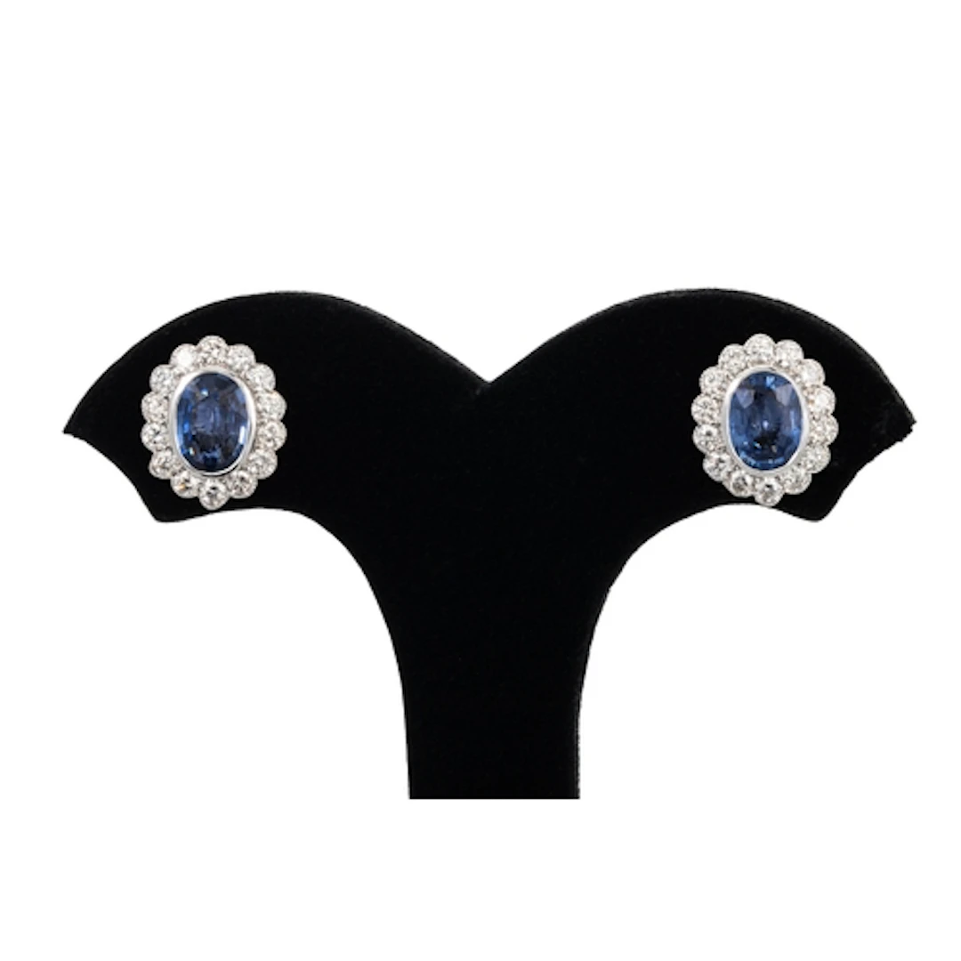 A PAIR OF SAPPHIRE AND DIAMOND CLUSTER EARRINGS, mounted in ...