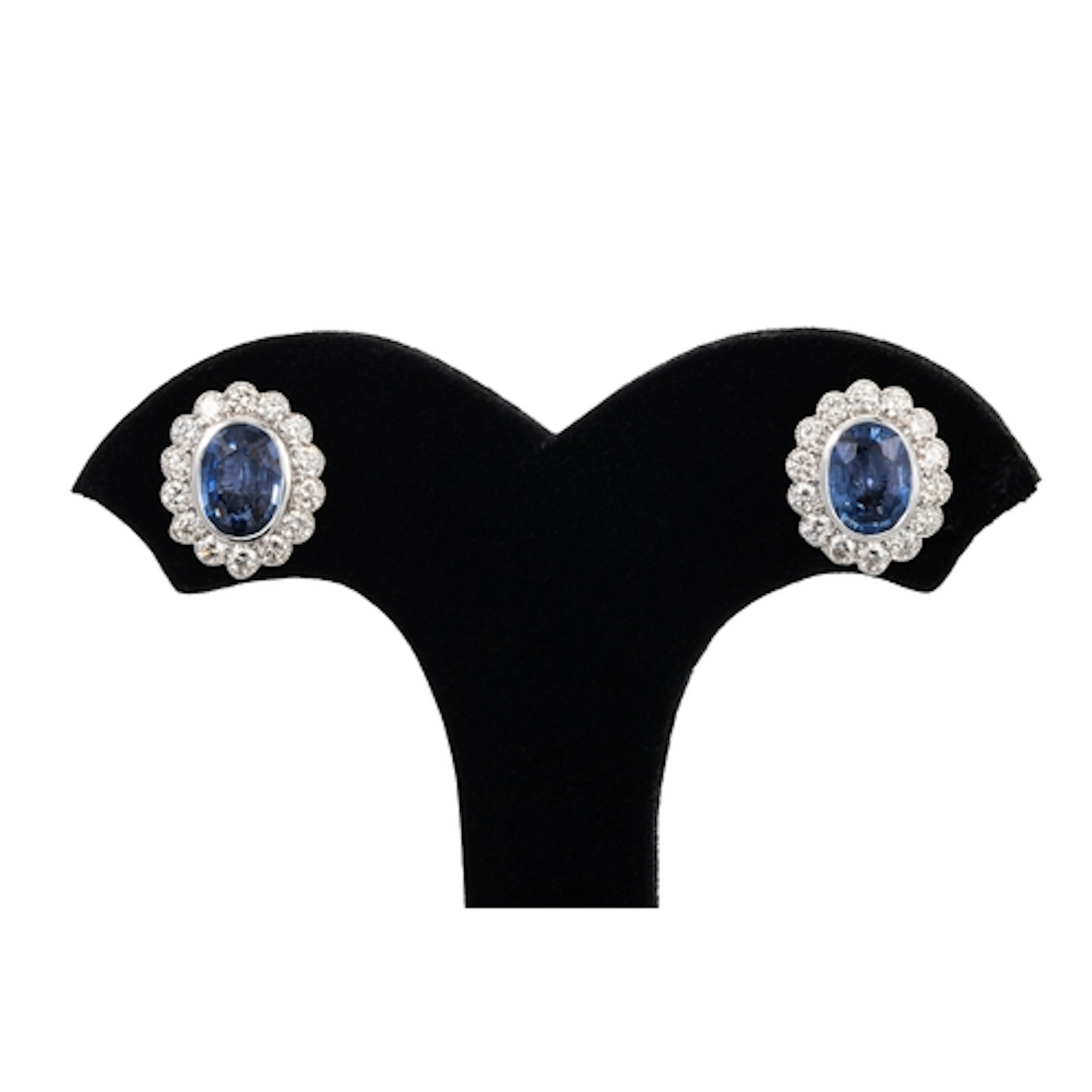 A PAIR OF SAPPHIRE AND DIAMOND CLUSTER EARRINGS, mounted in ...