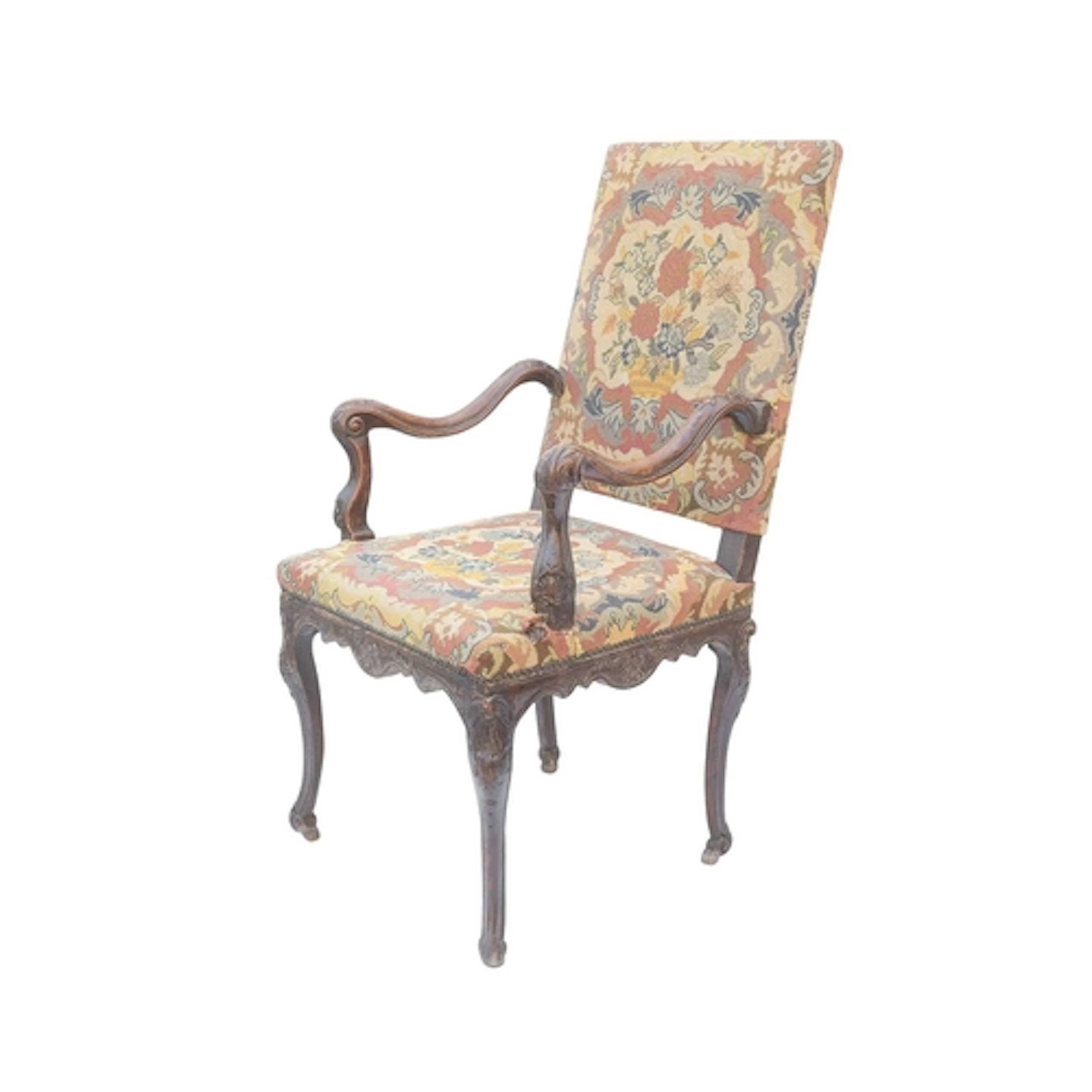 A French 18th century walnut armchair. With a tapestry uphol...