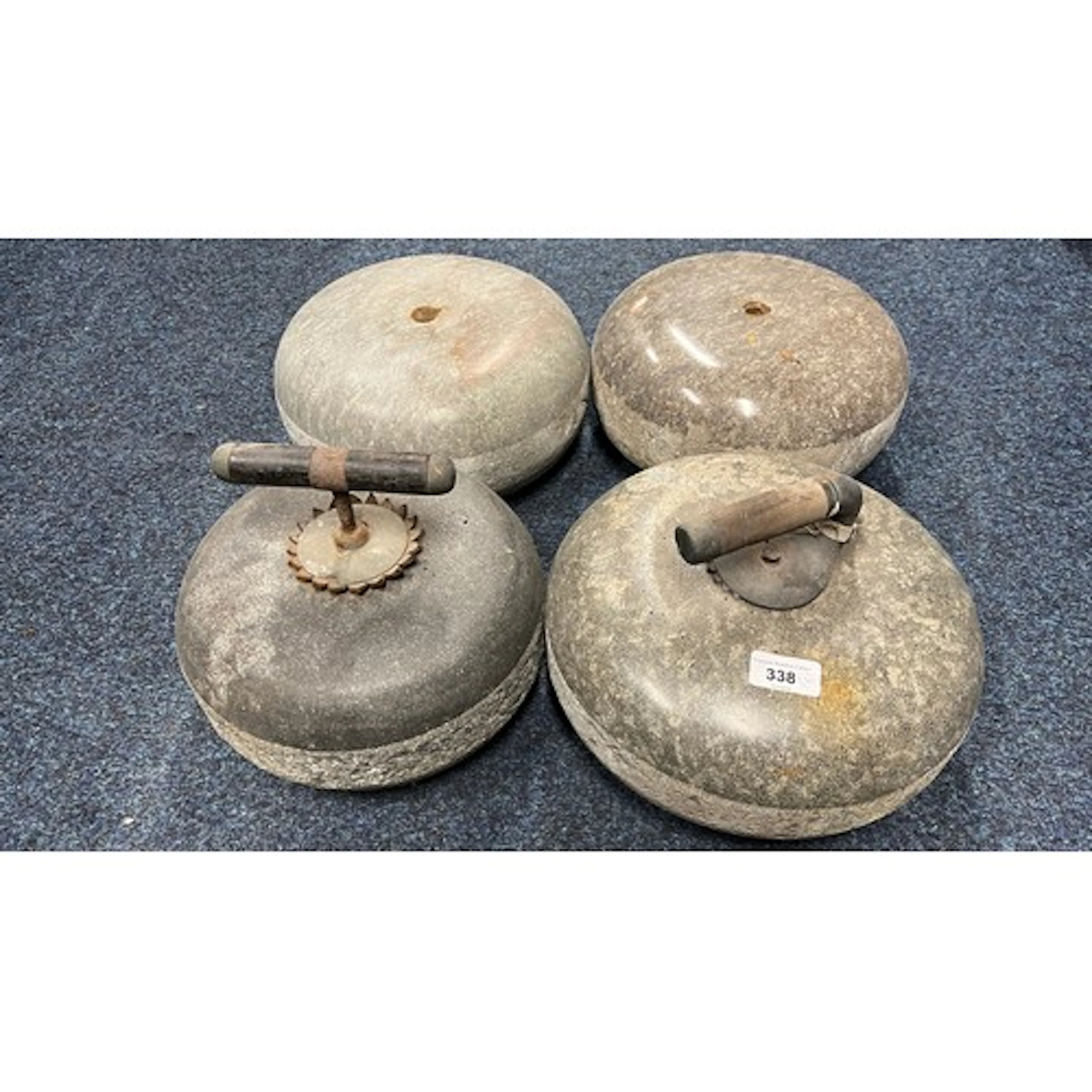 Group of four curling stones.