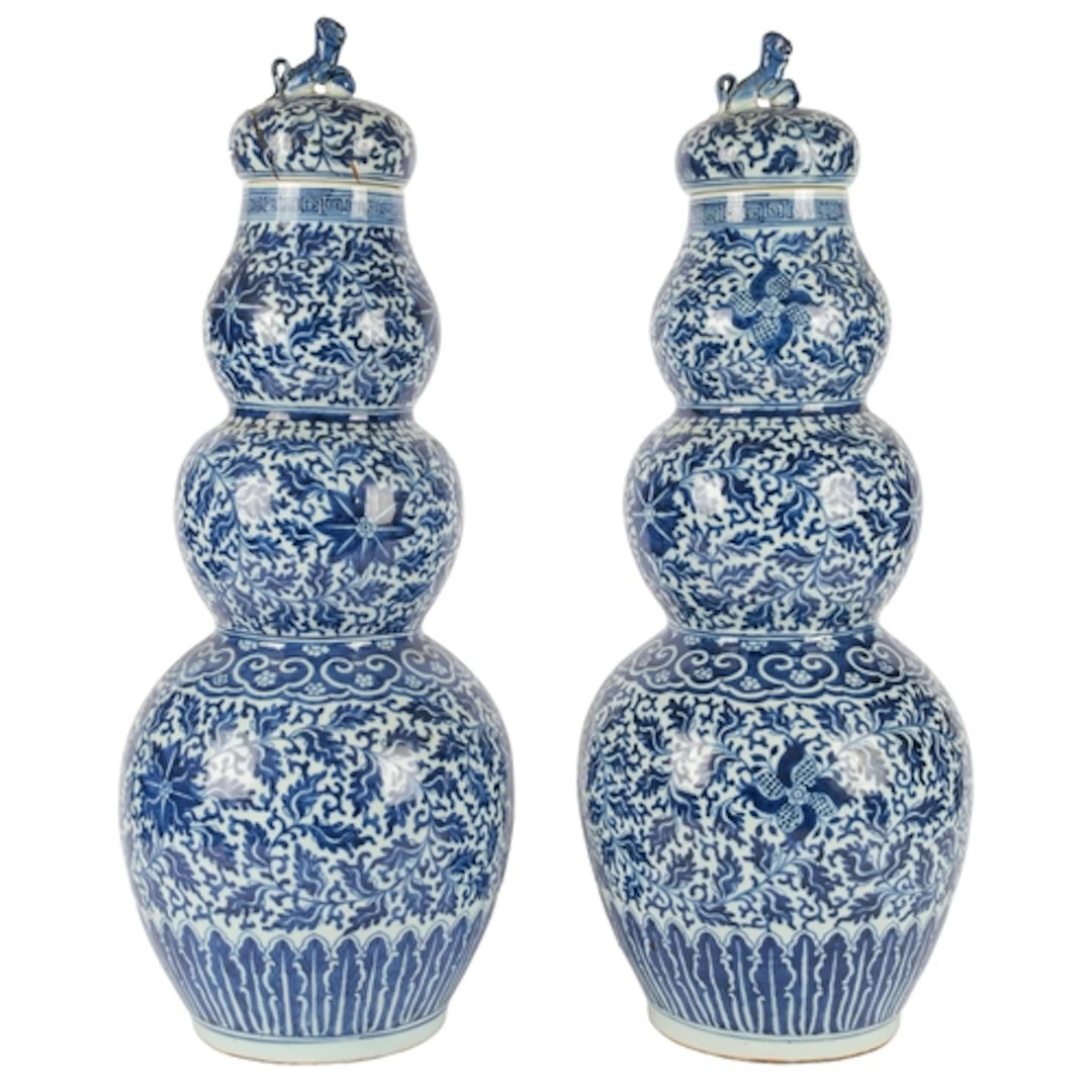 A pair of large Chinese blue and white triple gourd vases an...