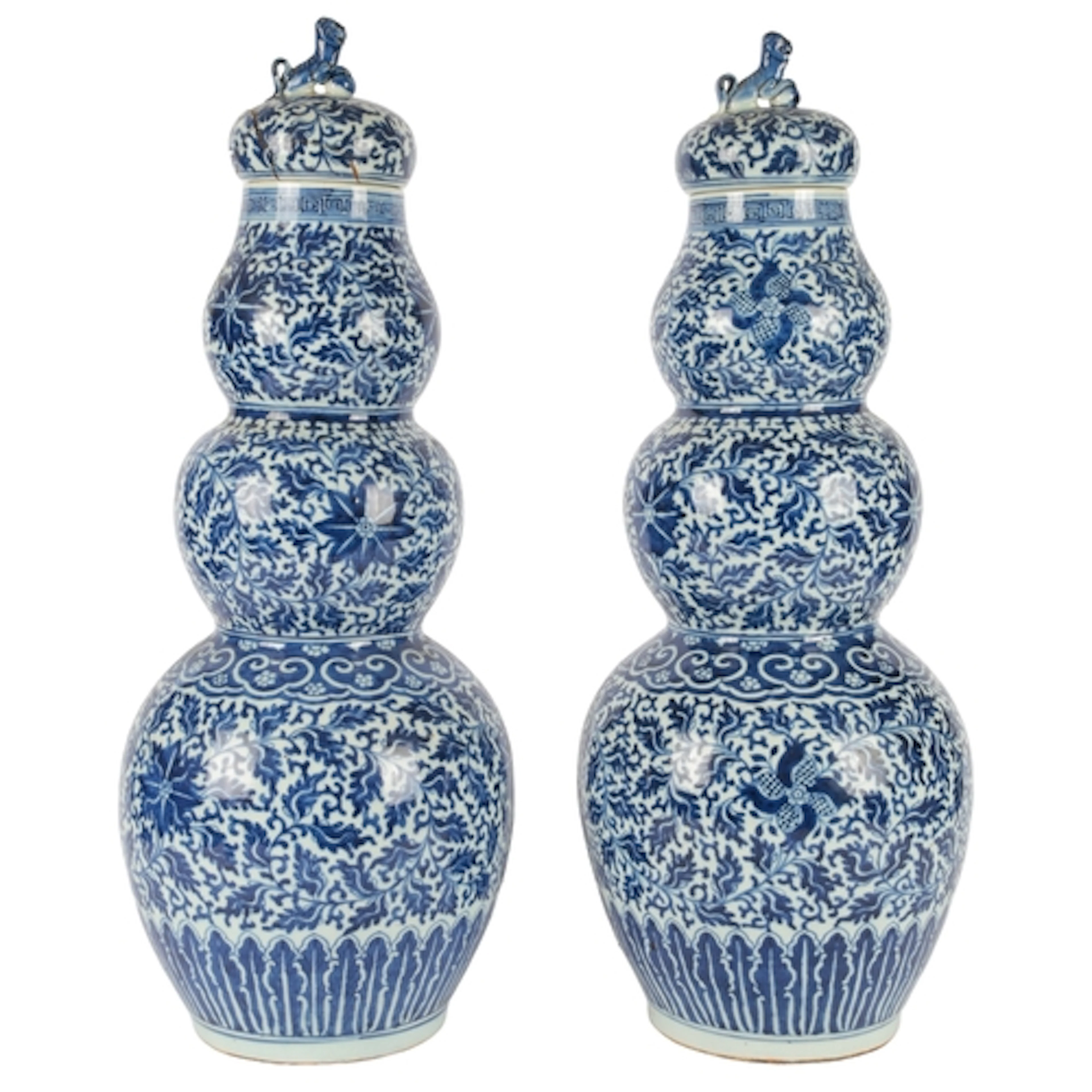 A pair of large Chinese blue and white triple gourd vases an...