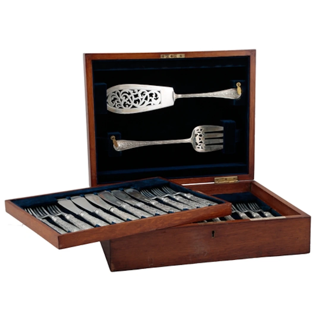 An Edwardian set of twelve pairs of silver fish eaters and a...