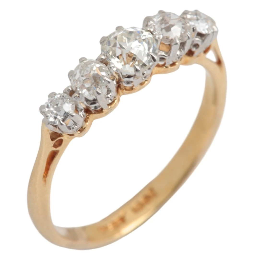 A five-stone diamond ring, early 20th century, claw-set with...