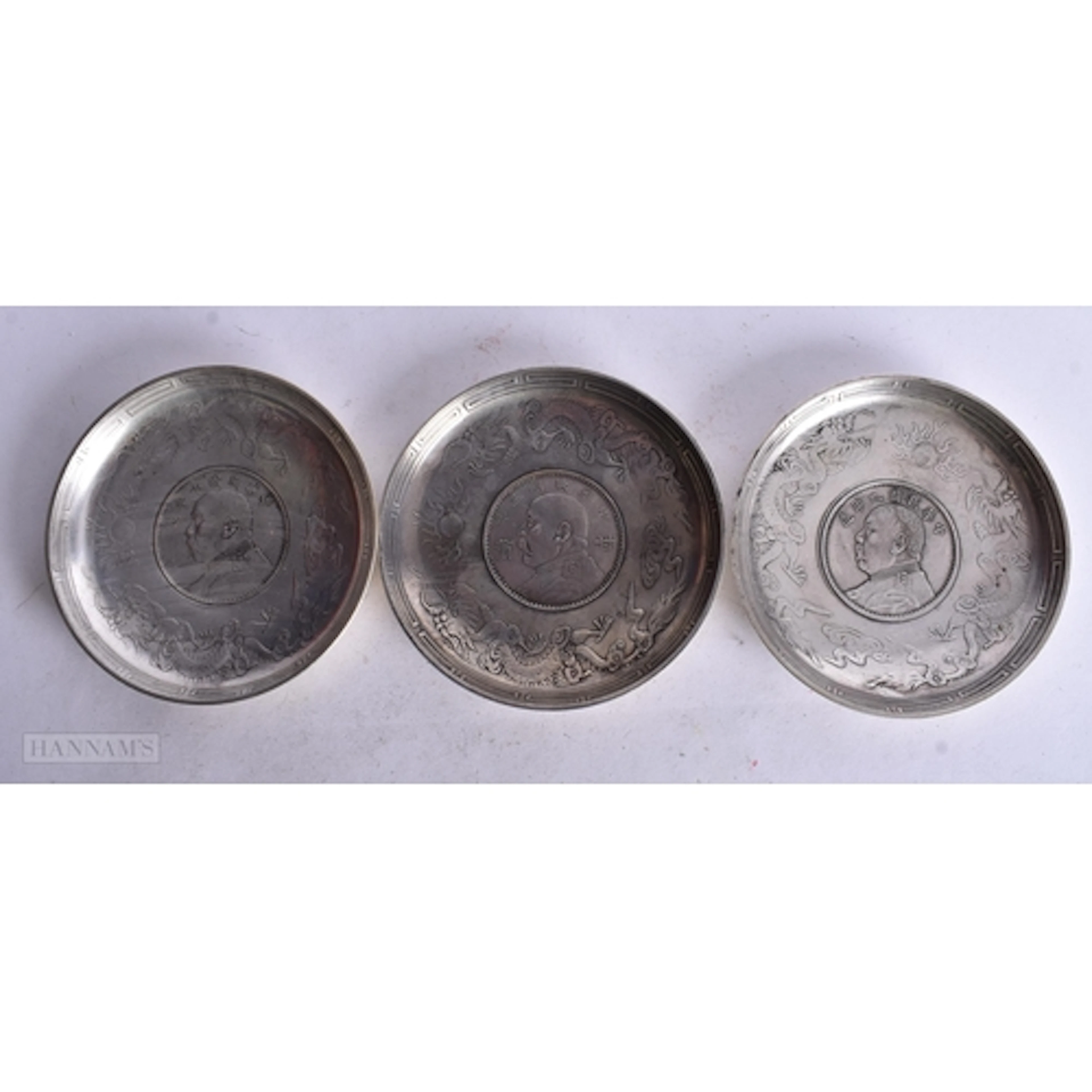 THREE CHINESE WHITE METAL COIN DISHES. 1.4 x 9.2 cm. 332.3 g...