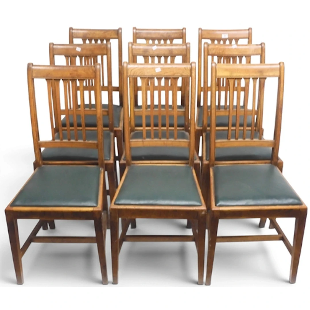 A set of nine late 19th century oak rail back dining chairs ...