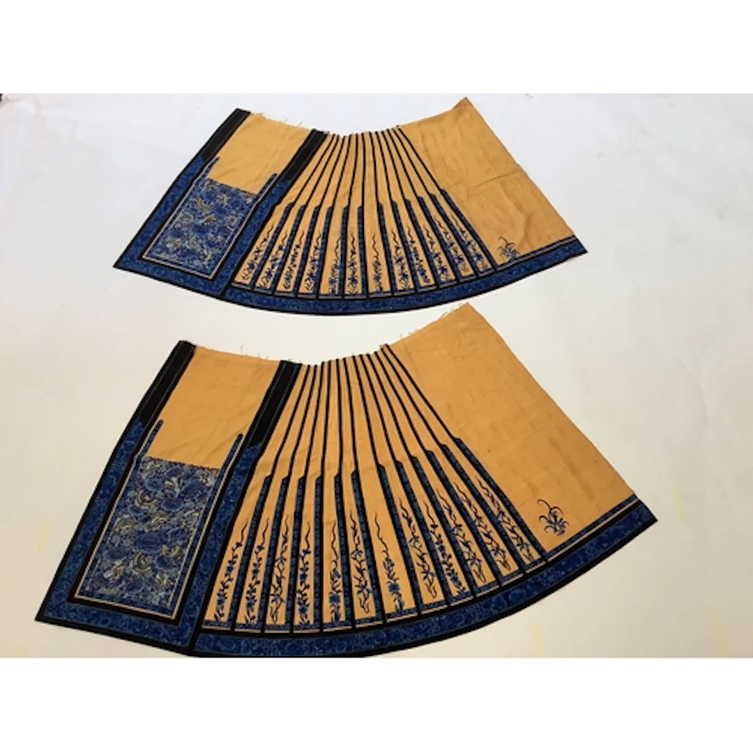 A matching pair of Chinese silk wedding skirts, blue embroid...