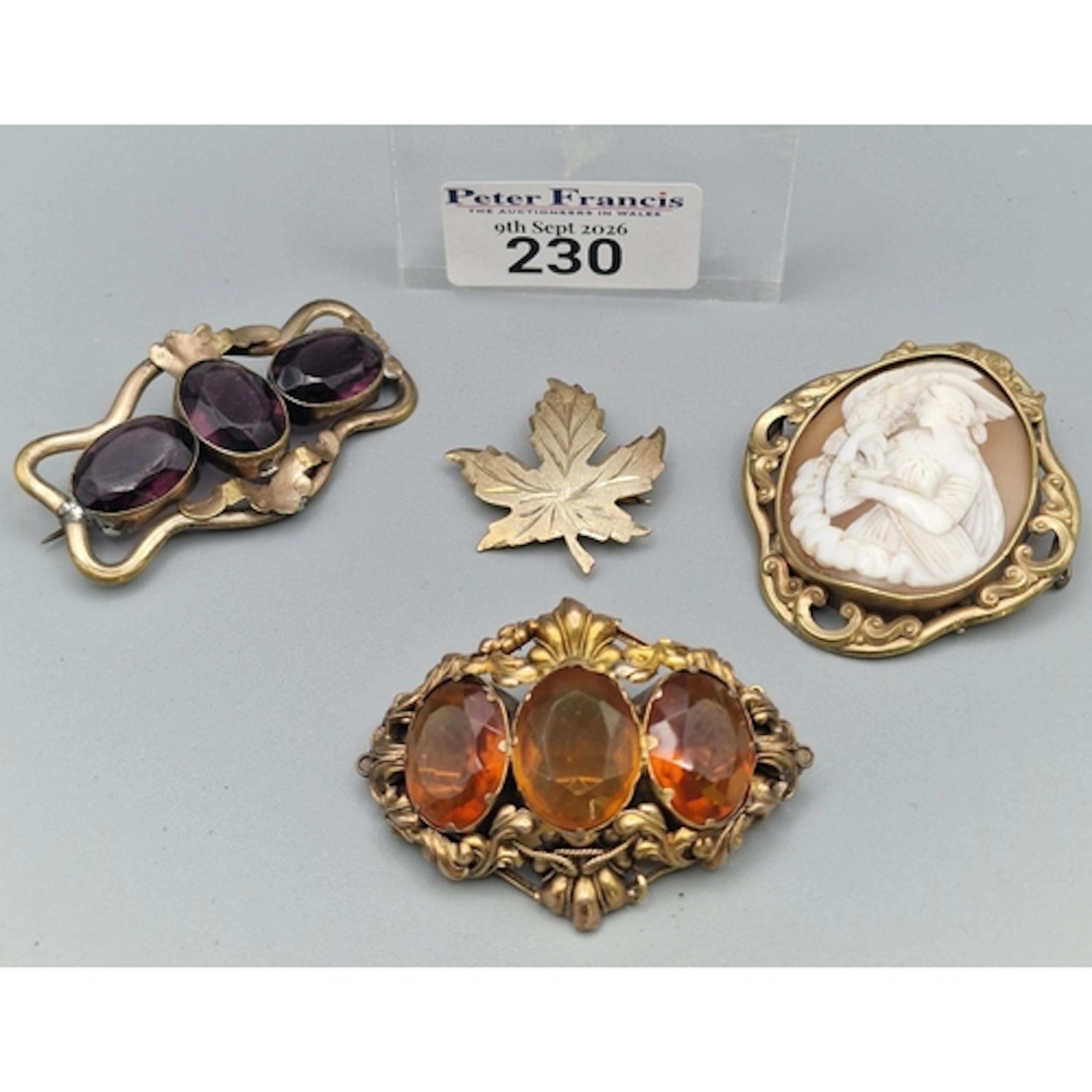 Gold toned leaf shaped brooch marked Sterling Front, togethe...