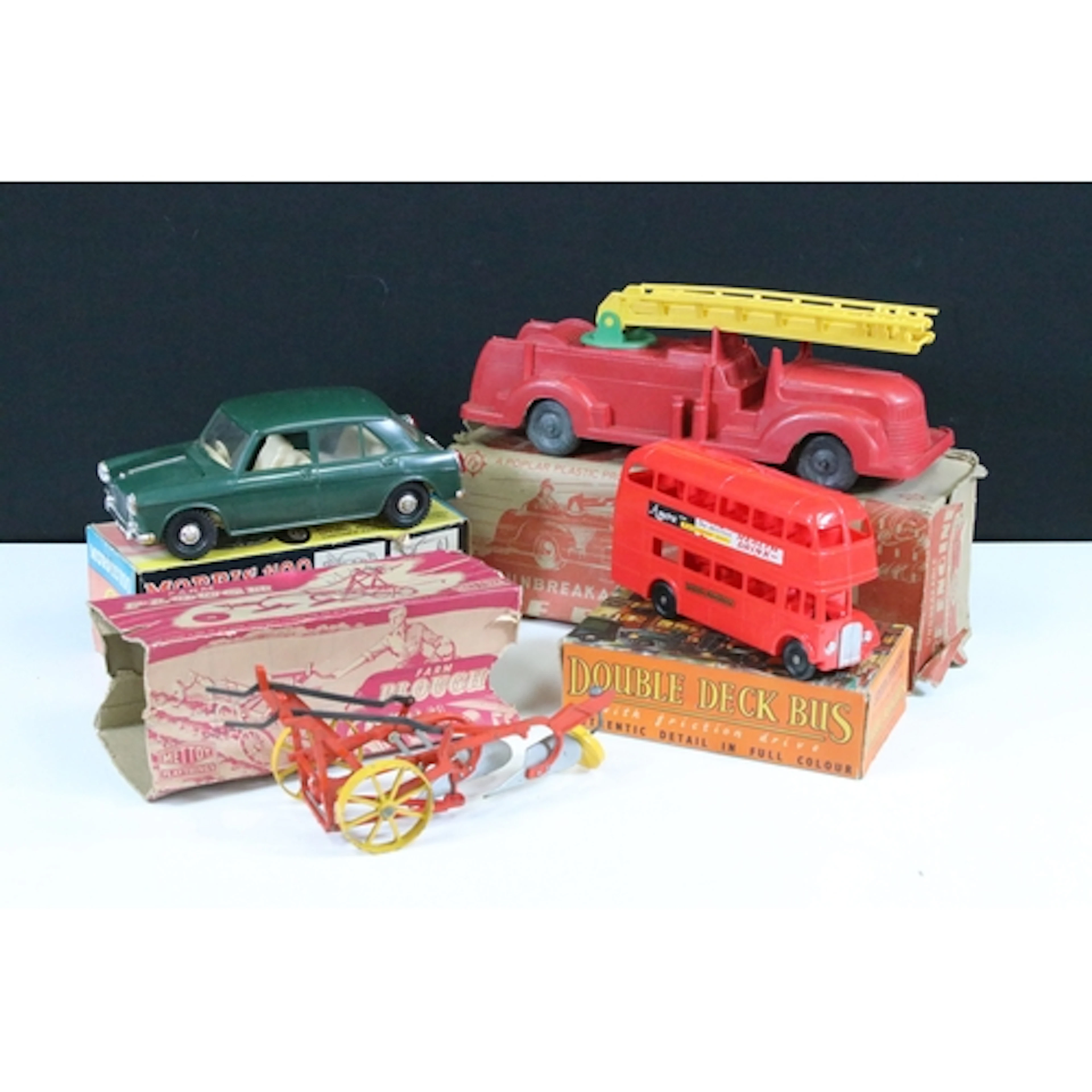 Four boxed models to include Mettoy Farm Plough, Poplar Plas...