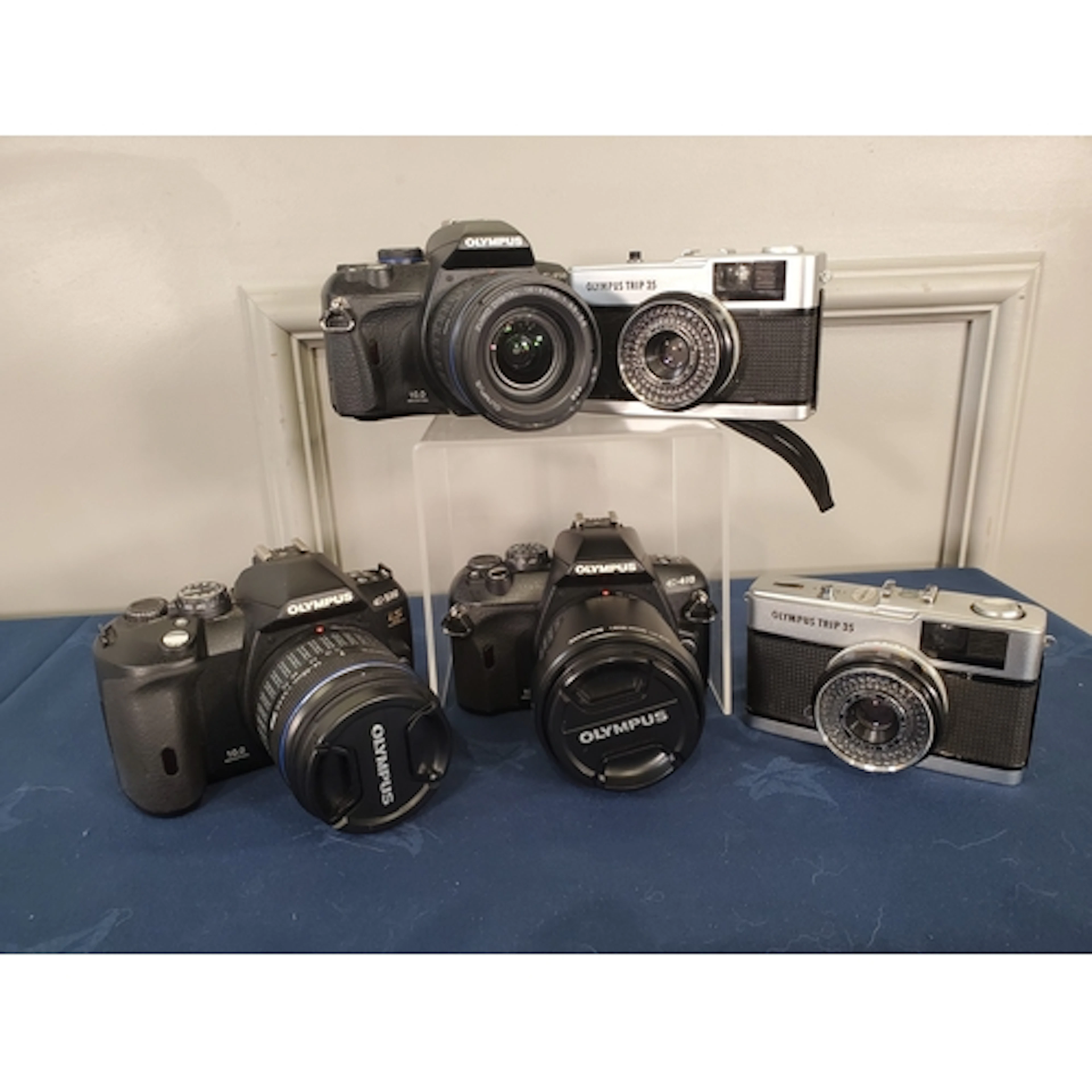 An Olympus E-410 with 14-42mm, an Olympus E-450 with 14-42m,...