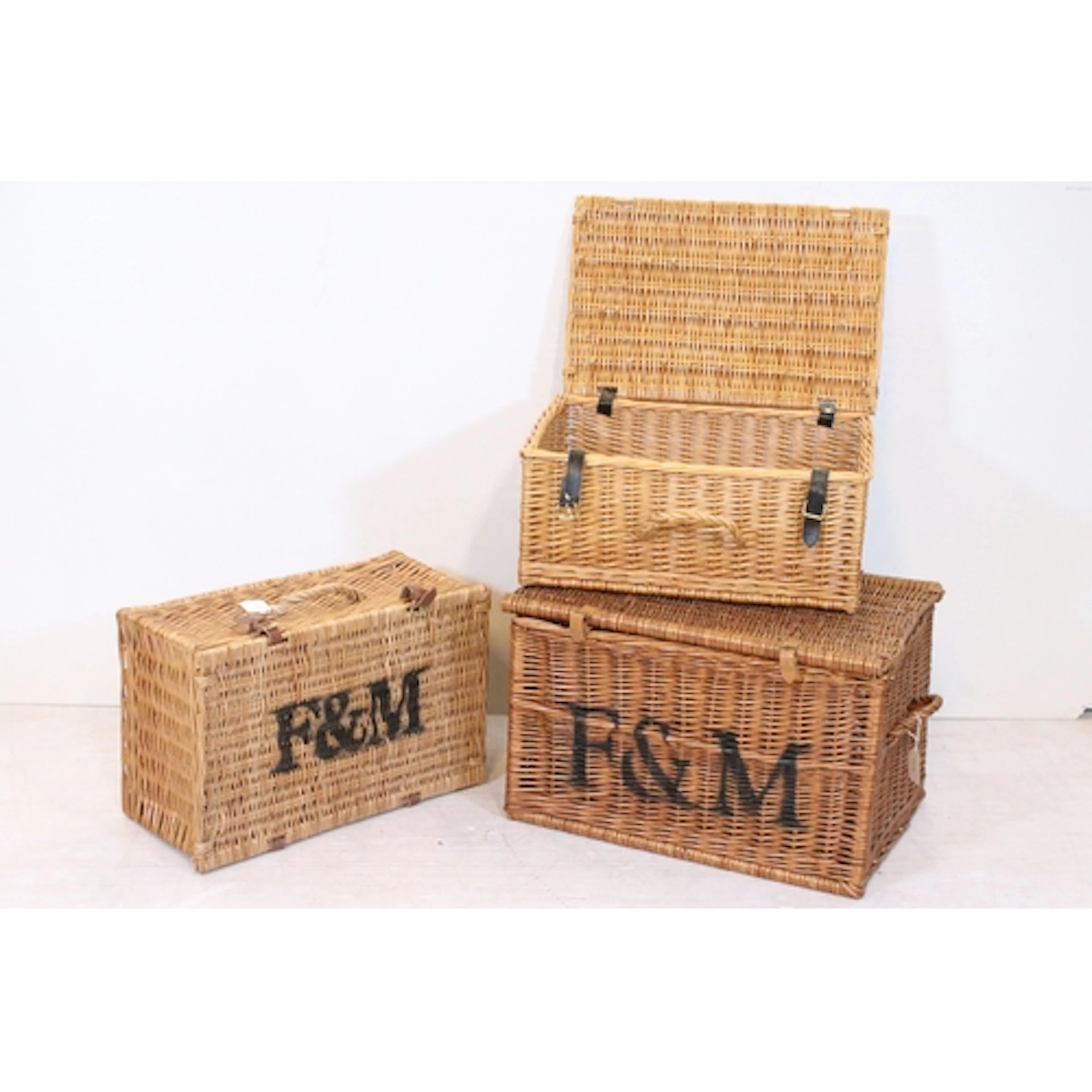 Three wicker hampers, to include a large Fortnum & Mason exa...
