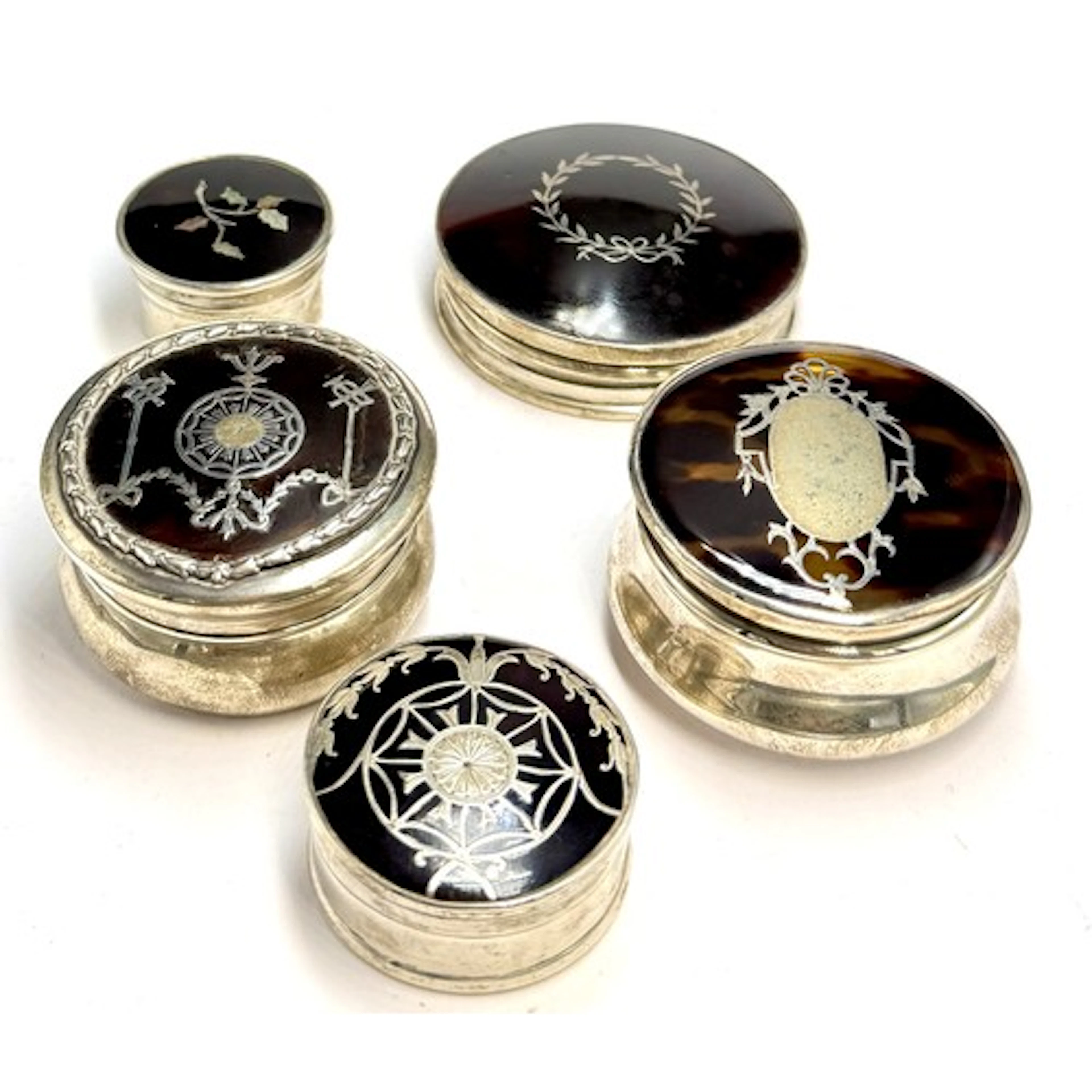 Five hallmarked silver and tortoiseshell pique boxes to incl...