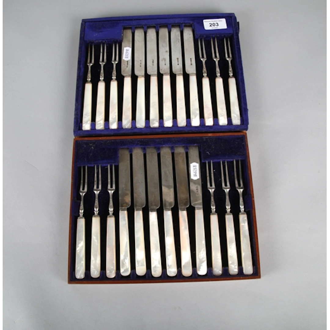 set of 12 silver mother of pearl fruit handled forks and kni...